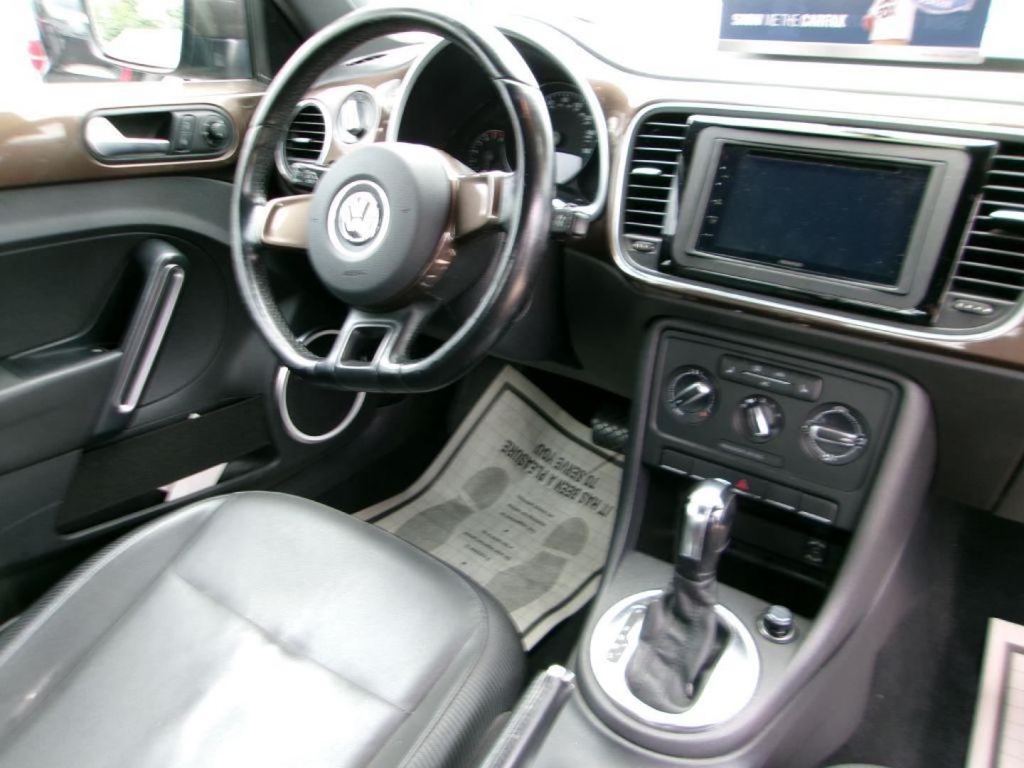 2012 BROWN VOLKSWAGEN BEETLE 2.5 (3VWJP7AT3CM) with an 2.5L engine, Automatic transmission, located at 501 E. Columbia St., Springfield, OH, 45503, (800) 262-7122, 39.925262, -83.801796 - *** Serviced and Detailed *** 2.5L *** Power Windows and Locks *** NICE!!! *** Jay North Auto has offered hand picked vehicles since 1965! Our customer's enjoy a NO pressure buying experience with a small town feel. All of our vehicles get fully inspected and detailed. We are a preferred dealer - Photo#7