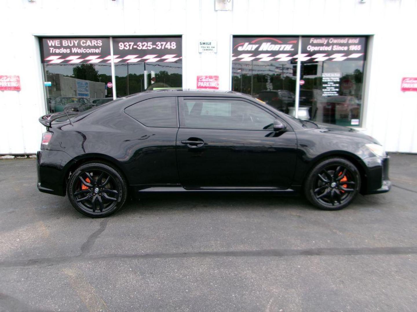 2014 BLACK SCION TC (JTKJF5C70E3) with an 2.5L engine, 6-Speed Manual transmission, located at 501 E. Columbia St., Springfield, OH, 45503, (800) 262-7122, 39.925262, -83.801796 - ***Scion TC***New Clutch***New Front and Rear Brake Pads and Rotors***Manual Transmission***SHARP***Serviced and Detailed*** Jay North Auto has offered hand picked vehicles since 1965! Our customer's enjoy a NO pressure buying experience with a small town feel. All of our vehicles get fully in - Photo#0