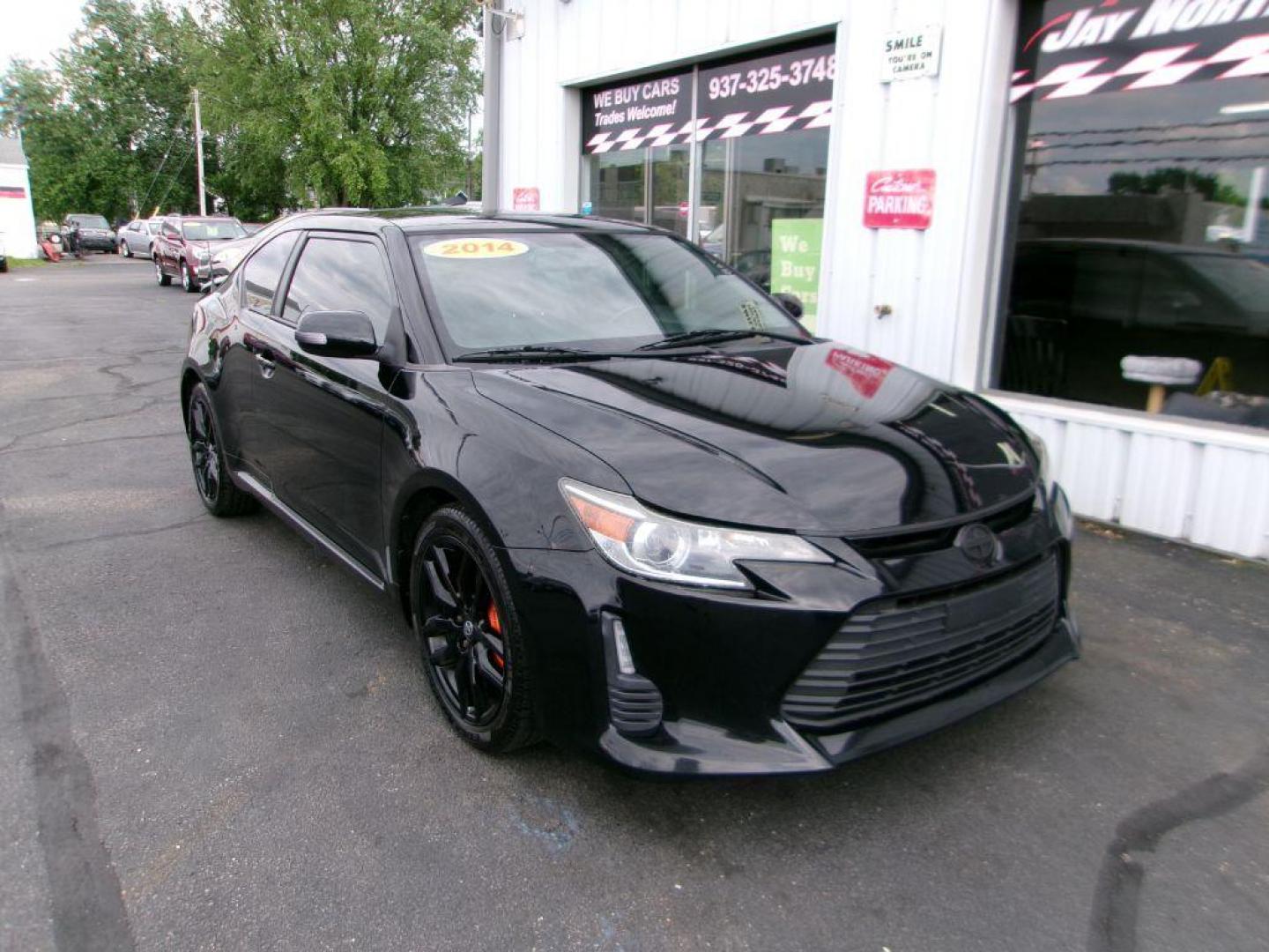 2014 BLACK SCION TC (JTKJF5C70E3) with an 2.5L engine, 6-Speed Manual transmission, located at 501 E. Columbia St., Springfield, OH, 45503, (800) 262-7122, 39.925262, -83.801796 - ***Scion TC***New Clutch***New Front and Rear Brake Pads and Rotors***Manual Transmission***SHARP***Serviced and Detailed*** Jay North Auto has offered hand picked vehicles since 1965! Our customer's enjoy a NO pressure buying experience with a small town feel. All of our vehicles get fully in - Photo#2