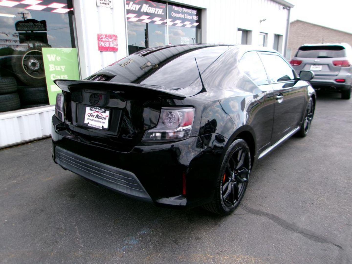 2014 BLACK SCION TC (JTKJF5C70E3) with an 2.5L engine, 6-Speed Manual transmission, located at 501 E. Columbia St., Springfield, OH, 45503, (800) 262-7122, 39.925262, -83.801796 - ***Scion TC***New Clutch***New Front and Rear Brake Pads and Rotors***Manual Transmission***SHARP***Serviced and Detailed*** Jay North Auto has offered hand picked vehicles since 1965! Our customer's enjoy a NO pressure buying experience with a small town feel. All of our vehicles get fully in - Photo#3