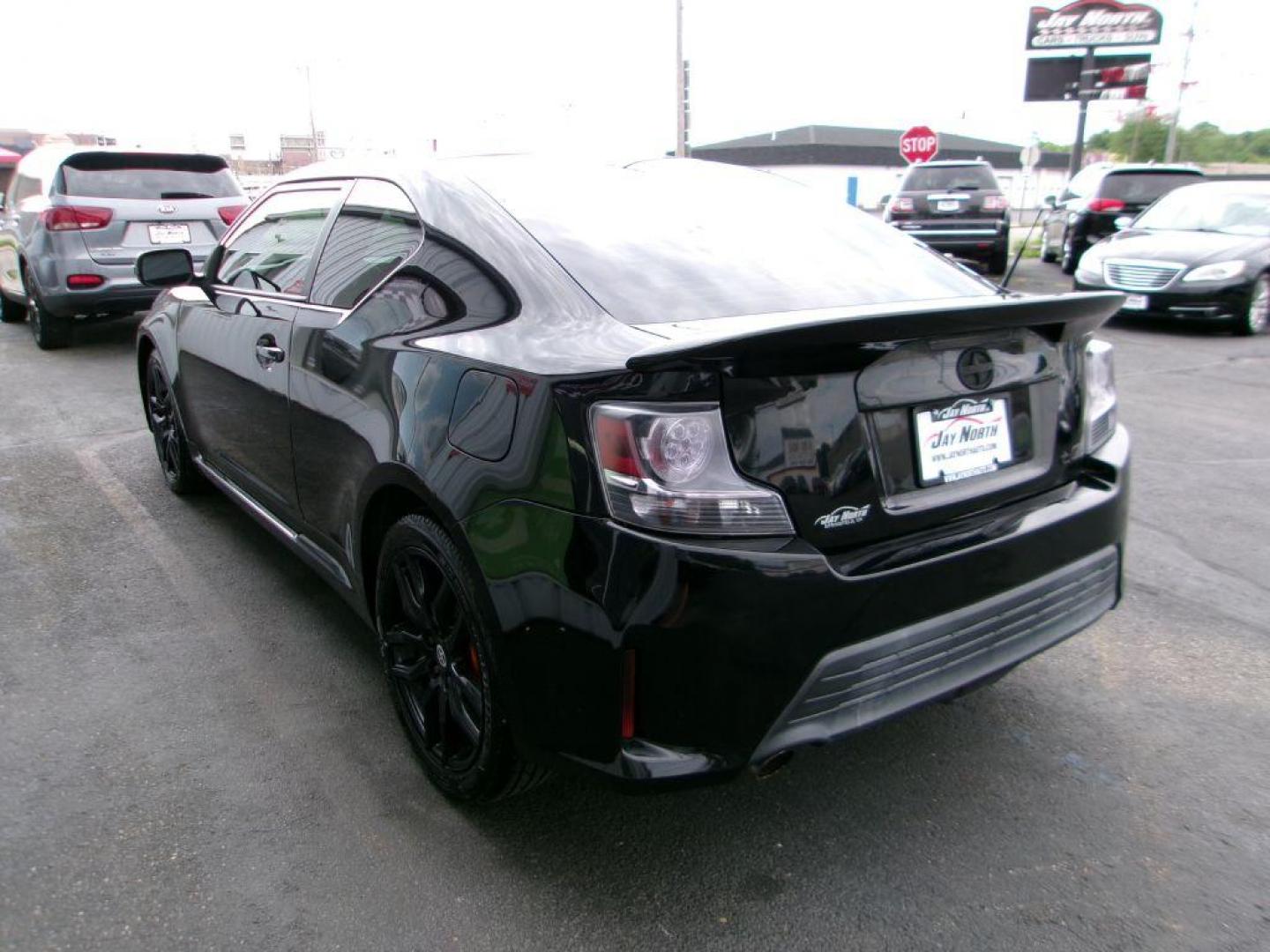 2014 BLACK SCION TC (JTKJF5C70E3) with an 2.5L engine, 6-Speed Manual transmission, located at 501 E. Columbia St., Springfield, OH, 45503, (800) 262-7122, 39.925262, -83.801796 - ***Scion TC***New Clutch***New Front and Rear Brake Pads and Rotors***Manual Transmission***SHARP***Serviced and Detailed*** Jay North Auto has offered hand picked vehicles since 1965! Our customer's enjoy a NO pressure buying experience with a small town feel. All of our vehicles get fully in - Photo#5