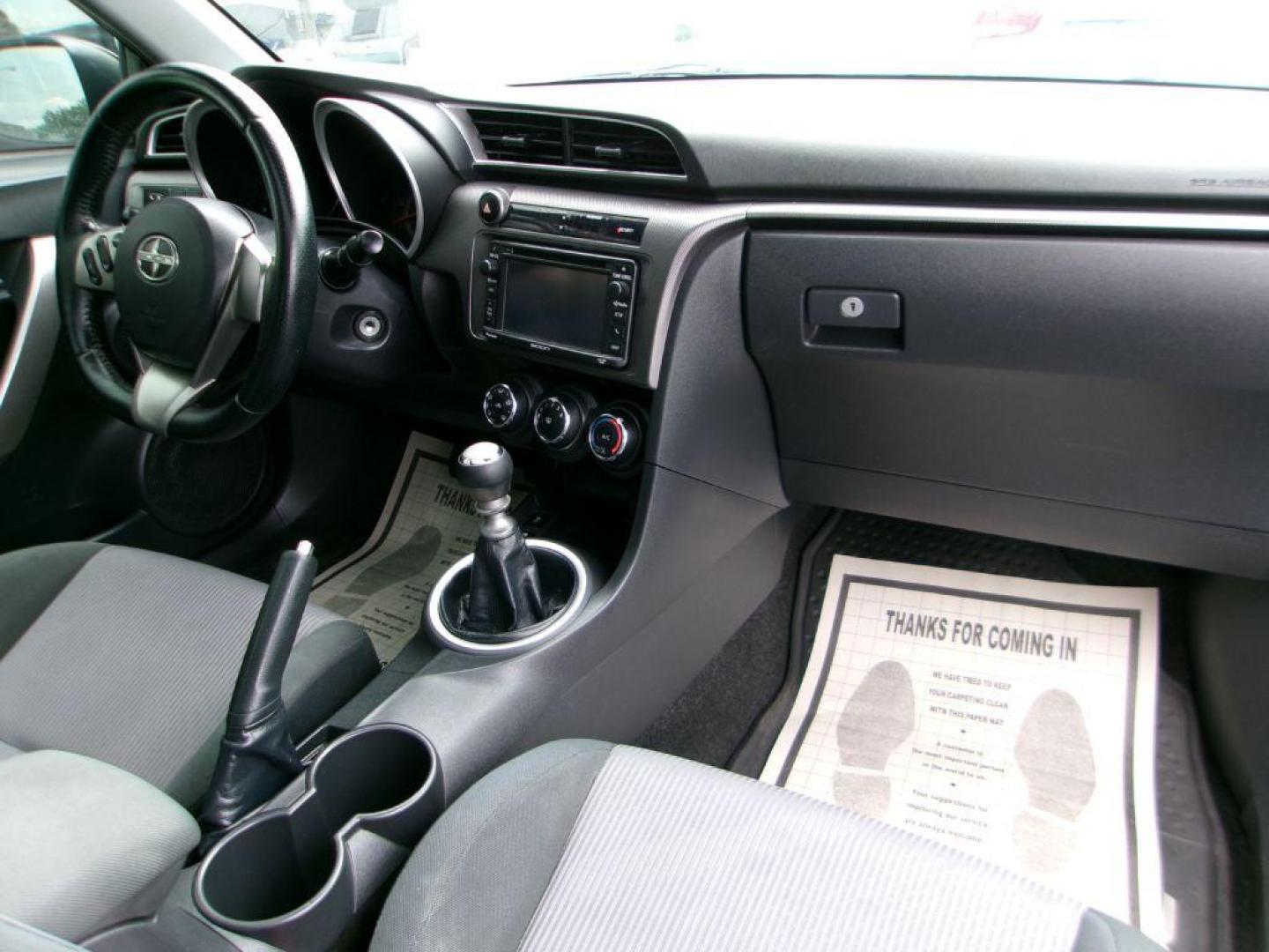2014 BLACK SCION TC (JTKJF5C70E3) with an 2.5L engine, 6-Speed Manual transmission, located at 501 E. Columbia St., Springfield, OH, 45503, (800) 262-7122, 39.925262, -83.801796 - ***Scion TC***New Clutch***New Front and Rear Brake Pads and Rotors***Manual Transmission***SHARP***Serviced and Detailed*** Jay North Auto has offered hand picked vehicles since 1965! Our customer's enjoy a NO pressure buying experience with a small town feel. All of our vehicles get fully in - Photo#16