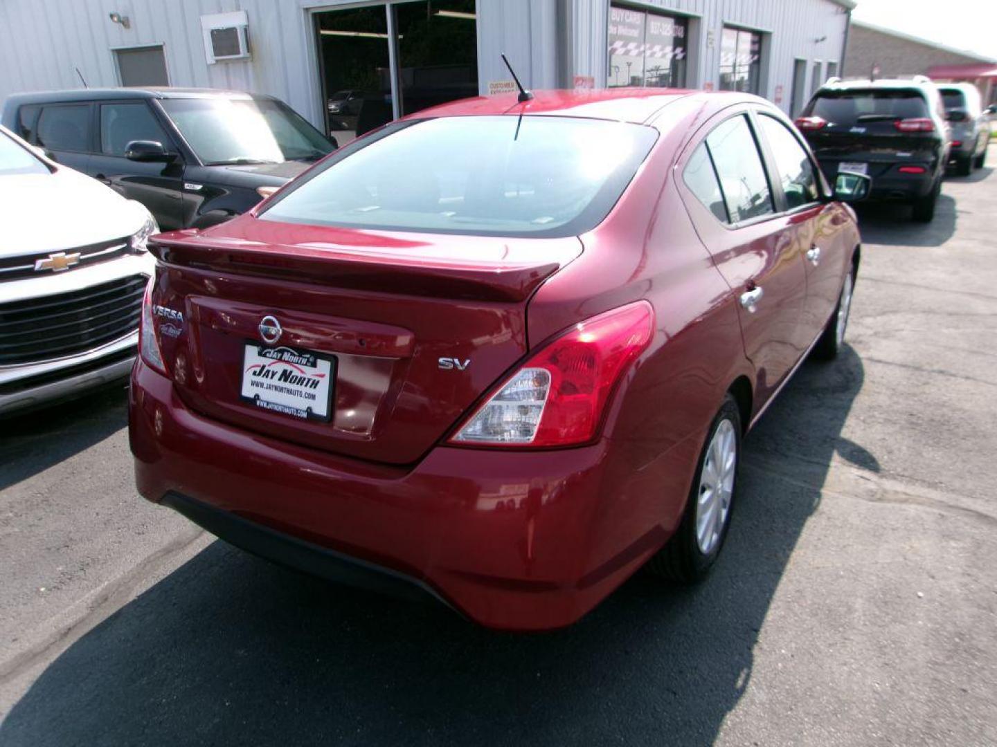 2019 RED NISSAN VERSA SV (3N1CN7AP7KL) with an 1.6L engine, Continuously Variable transmission, located at 501 E. Columbia St., Springfield, OH, 45503, (800) 262-7122, 39.925262, -83.801796 - *** SV *** Serviced and Detailed *** Back Up Camera *** Power Windows and Locks *** Jay North Auto has offered hand picked vehicles since 1965! Our customer's enjoy a NO pressure buying experience with a small town feel. All of our vehicles get fully inspected and detailed. We are a preferred de - Photo#3