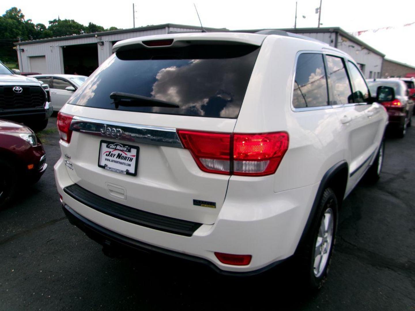 2011 WHITE JEEP GRAND CHEROKEE LAREDO (1J4RR4GG5BC) with an 3.6L engine, Automatic transmission, located at 501 E. Columbia St., Springfield, OH, 45503, (800) 262-7122, 39.925262, -83.801796 - *** 1 Owner *** 19 Service Records on Clean CarFax *** New Battery New Rear Brakes *** Serviced and Detailed *** Jay North Auto has offered hand picked vehicles since 1965! Our customer's enjoy a NO pressure buying experience with a small town feel. All of our vehicles get fully inspected and d - Photo#4