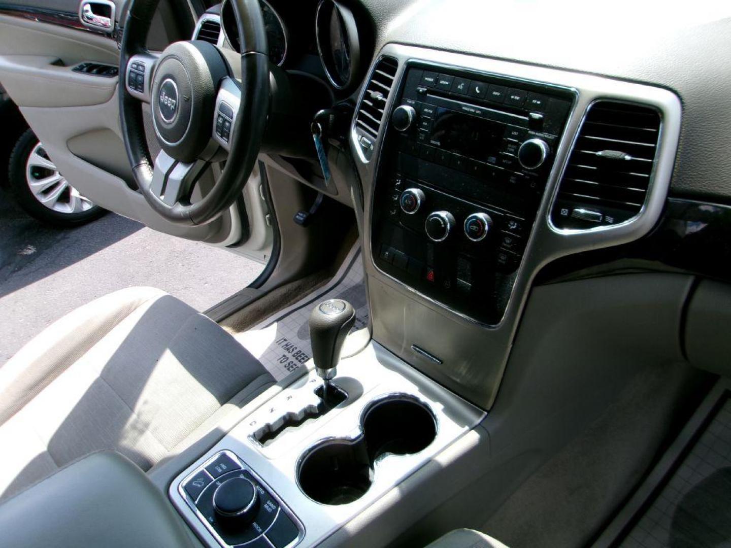 2011 WHITE JEEP GRAND CHEROKEE LAREDO (1J4RR4GG5BC) with an 3.6L engine, Automatic transmission, located at 501 E. Columbia St., Springfield, OH, 45503, (800) 262-7122, 39.925262, -83.801796 - *** 1 Owner *** 19 Service Records on Clean CarFax *** New Battery New Rear Brakes *** Serviced and Detailed *** Jay North Auto has offered hand picked vehicles since 1965! Our customer's enjoy a NO pressure buying experience with a small town feel. All of our vehicles get fully inspected and d - Photo#14