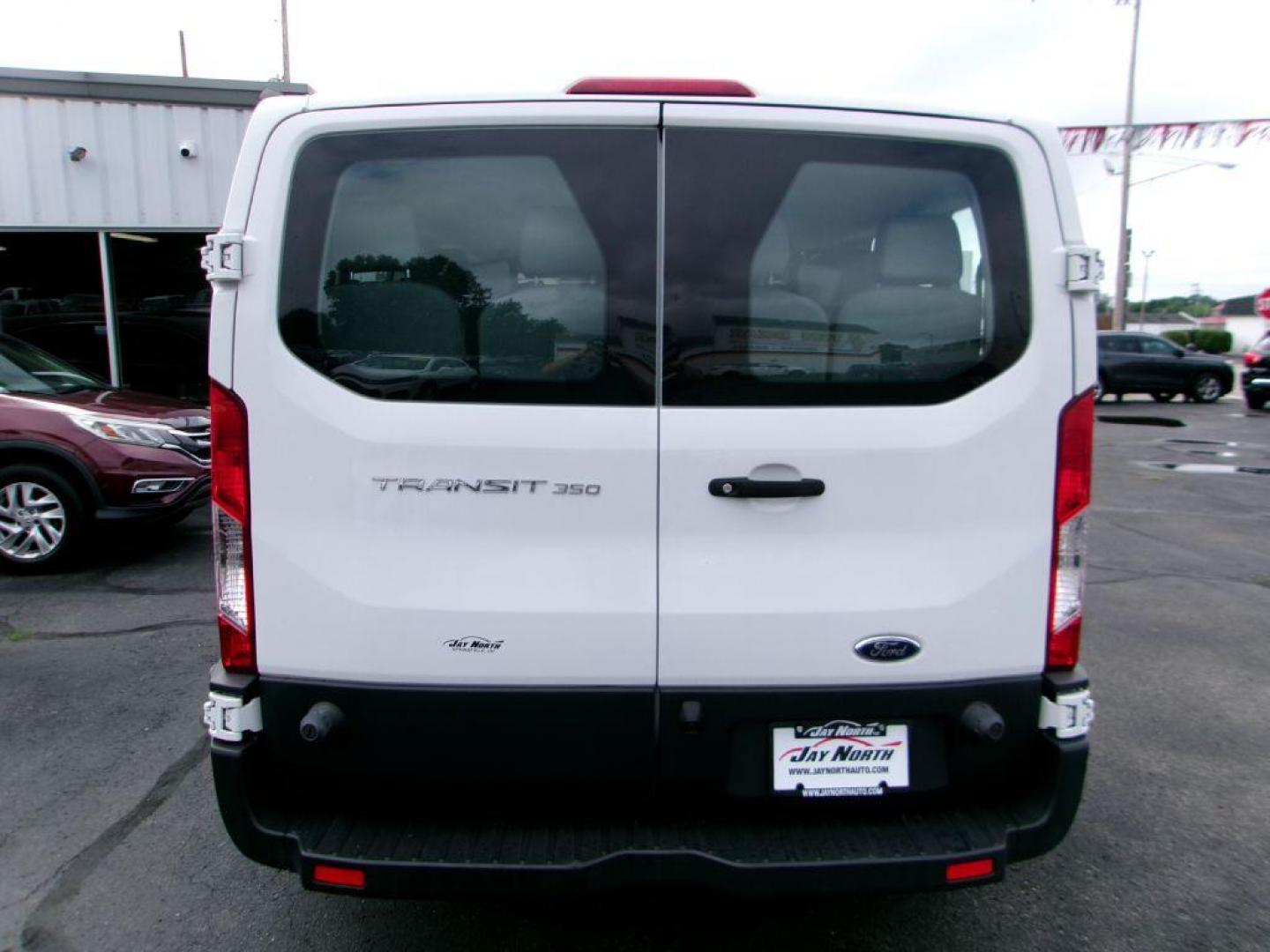 2018 WHITE FORD TRANSIT T-350 (1FBZX2ZM8JK) with an 3.7L engine, Automatic transmission, located at 501 E. Columbia St., Springfield, OH, 45503, (800) 262-7122, 39.925262, -83.801796 - *** New Tires *** 1 Owner *** Serviced and Detailed *** 15 Passenger *** 3.7L *** Low Miles *** Jay North Auto has offered hand picked vehicles since 1965! Our customer's enjoy a NO pressure buying experience with a small town feel. All of our vehicles get fully inspected and detailed. We are a - Photo#5