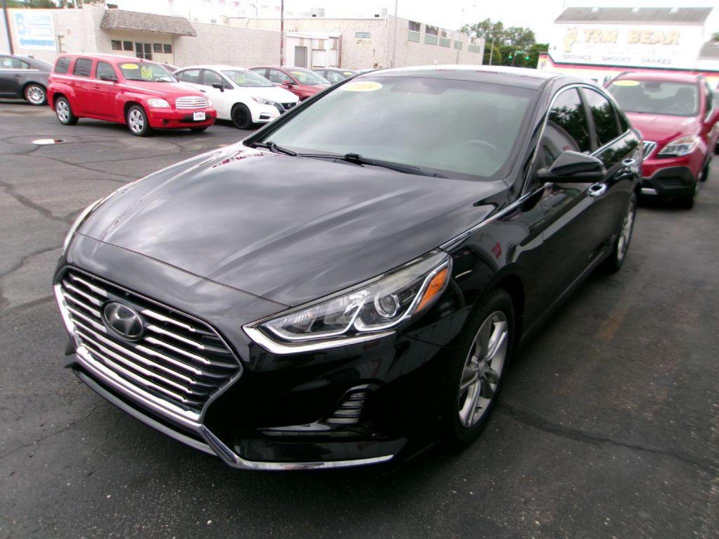 2018 BLACK HYUNDAI SONATA SEL (5NPE34AF4JH) with an 2.4L engine, Automatic transmission, located at 501 E. Columbia St., Springfield, OH, 45503, (800) 262-7122, 39.925262, -83.801796 - ADVANCED SAFETY TECHNOLOGY Blind Spot Detection System w/ Rear Cross-Traffic Alert INCLUDED Vehicle Stability Management (VSM) w/ Traction Control INCLUDED ABS w/ Electronic Brake Force Distribution and Brake Assist INCLUDED Front, Front Side Impact, Side Curtain and Driver Knee Airbags - Photo#2