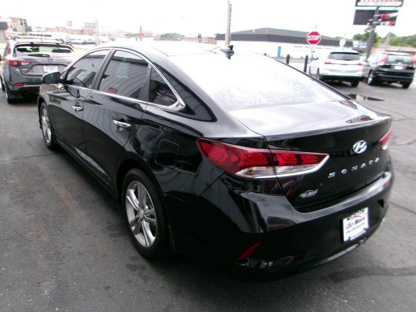 2018 BLACK HYUNDAI SONATA SEL (5NPE34AF4JH) with an 2.4L engine, Automatic transmission, located at 501 E. Columbia St., Springfield, OH, 45503, (800) 262-7122, 39.925262, -83.801796 - ADVANCED SAFETY TECHNOLOGY Blind Spot Detection System w/ Rear Cross-Traffic Alert INCLUDED Vehicle Stability Management (VSM) w/ Traction Control INCLUDED ABS w/ Electronic Brake Force Distribution and Brake Assist INCLUDED Front, Front Side Impact, Side Curtain and Driver Knee Airbags - Photo#4