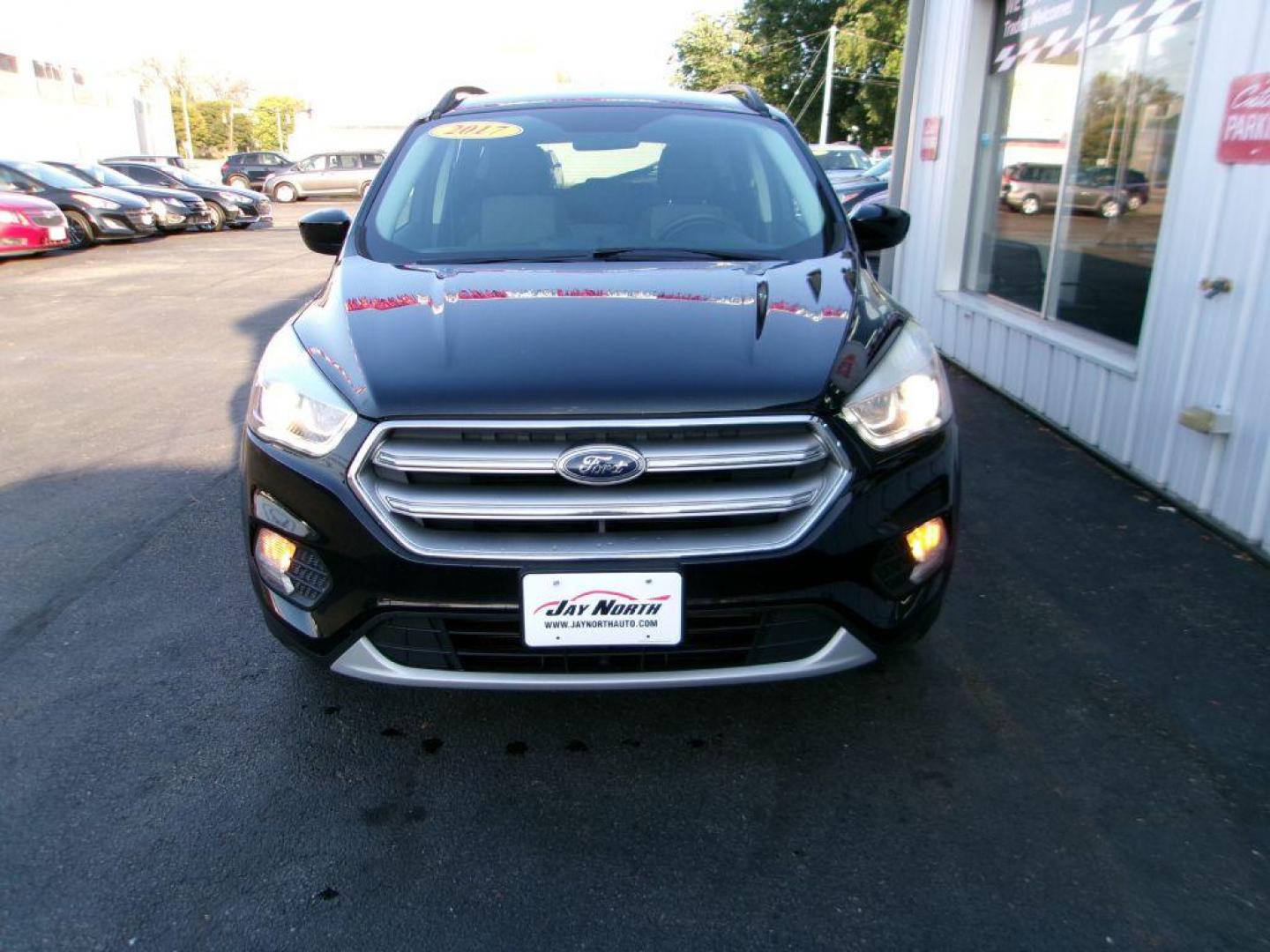 2017 BLACK FORD ESCAPE SE (1FMCU9G91HU) with an 2.0L engine, Automatic transmission, located at 501 E. Columbia St., Springfield, OH, 45503, (800) 262-7122, 39.925262, -83.801796 - ***Clean Carfax***New Front and Rear Brake Pads and Rotors***New Tires***AWD***EcoBoost***SE***Heated Seats***Serviced and Detailed*** Jay North Auto has offered hand picked vehicles since 1965! Our customer's enjoy a NO pressure buying experience with a small town feel. All of our vehicles ge - Photo#1