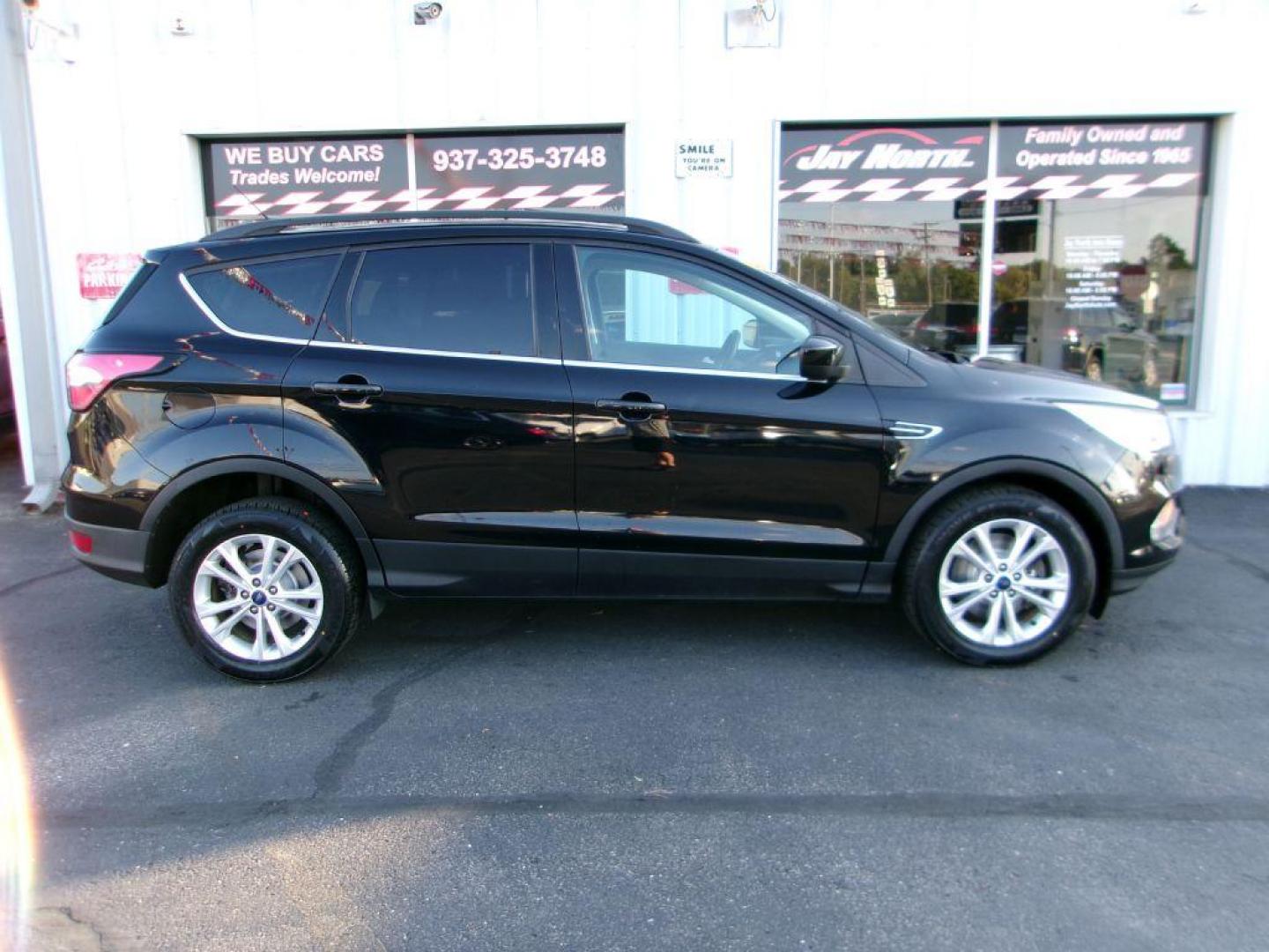 2017 BLACK FORD ESCAPE SE (1FMCU9G91HU) with an 2.0L engine, Automatic transmission, located at 501 E. Columbia St., Springfield, OH, 45503, (800) 262-7122, 39.925262, -83.801796 - ***Clean Carfax***New Front and Rear Brake Pads and Rotors***New Tires***AWD***EcoBoost***SE***Heated Seats***Serviced and Detailed*** Jay North Auto has offered hand picked vehicles since 1965! Our customer's enjoy a NO pressure buying experience with a small town feel. All of our vehicles ge - Photo#2
