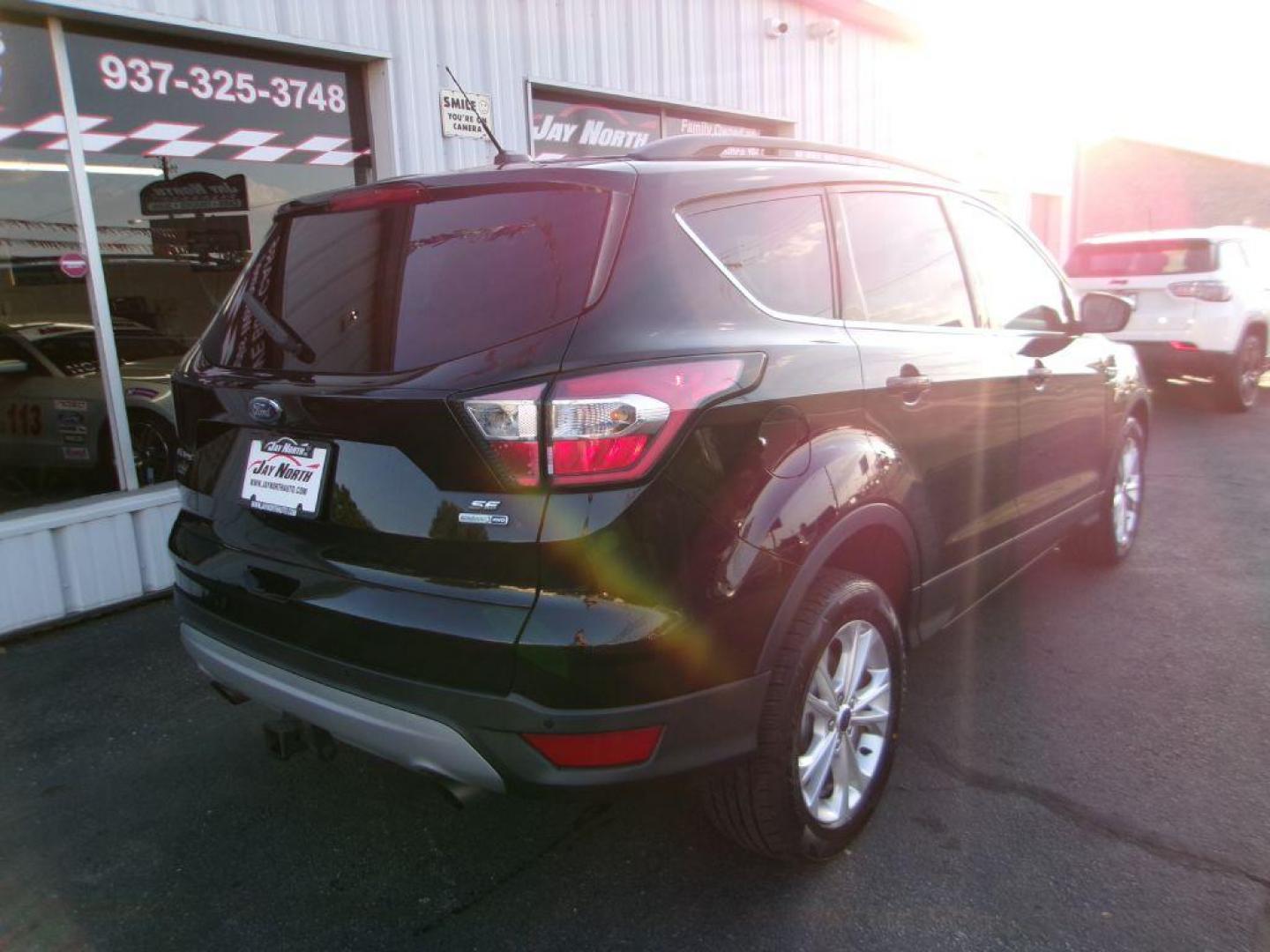 2017 BLACK FORD ESCAPE SE (1FMCU9G91HU) with an 2.0L engine, Automatic transmission, located at 501 E. Columbia St., Springfield, OH, 45503, (800) 262-7122, 39.925262, -83.801796 - ***Clean Carfax***New Front and Rear Brake Pads and Rotors***New Tires***AWD***EcoBoost***SE***Heated Seats***Serviced and Detailed*** Jay North Auto has offered hand picked vehicles since 1965! Our customer's enjoy a NO pressure buying experience with a small town feel. All of our vehicles ge - Photo#3