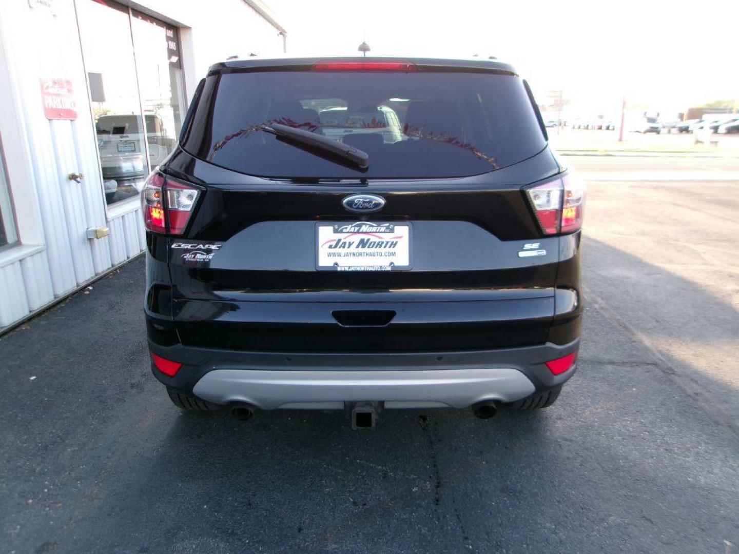2017 BLACK FORD ESCAPE SE (1FMCU9G91HU) with an 2.0L engine, Automatic transmission, located at 501 E. Columbia St., Springfield, OH, 45503, (800) 262-7122, 39.925262, -83.801796 - ***Clean Carfax***New Front and Rear Brake Pads and Rotors***New Tires***AWD***EcoBoost***SE***Heated Seats***Serviced and Detailed*** Jay North Auto has offered hand picked vehicles since 1965! Our customer's enjoy a NO pressure buying experience with a small town feel. All of our vehicles ge - Photo#4