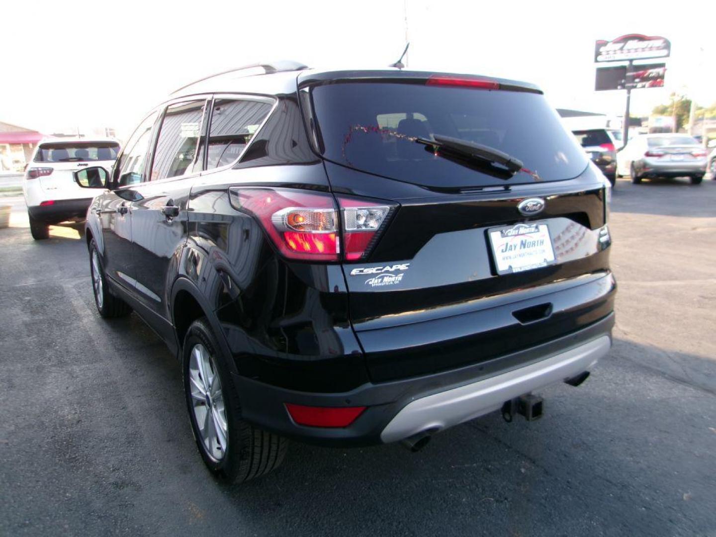 2017 BLACK FORD ESCAPE SE (1FMCU9G91HU) with an 2.0L engine, Automatic transmission, located at 501 E. Columbia St., Springfield, OH, 45503, (800) 262-7122, 39.925262, -83.801796 - ***Clean Carfax***New Front and Rear Brake Pads and Rotors***New Tires***AWD***EcoBoost***SE***Heated Seats***Serviced and Detailed*** Jay North Auto has offered hand picked vehicles since 1965! Our customer's enjoy a NO pressure buying experience with a small town feel. All of our vehicles ge - Photo#5