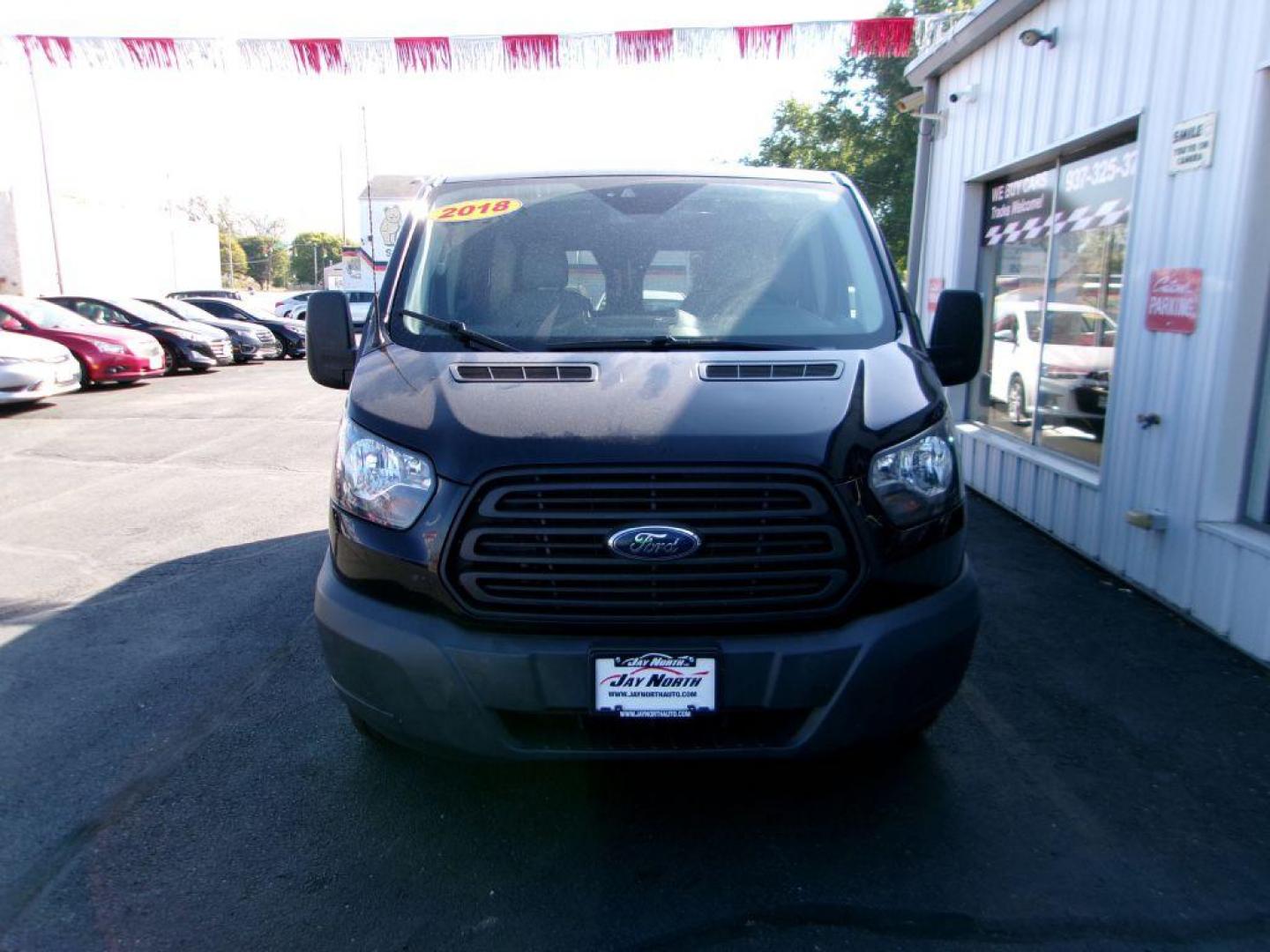 2018 BLACK FORD TRANSIT T-150 (1FTYE1ZM7JK) with an 3.7L engine, Automatic transmission, located at 501 E. Columbia St., Springfield, OH, 45503, (800) 262-7122, 39.925262, -83.801796 - ***1-Owner***T-150***Tinted Glass***New Front Brakes***Back-up Camera***Serviced and Detailed*** Jay North Auto has offered hand picked vehicles since 1965! Our customer's enjoy a NO pressure buying experience with a small town feel. All of our vehicles get fully inspected and detailed. We are - Photo#1