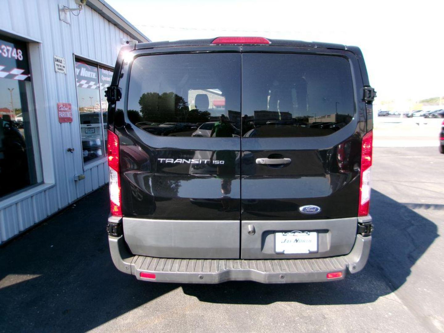2018 BLACK FORD TRANSIT T-150 (1FTYE1ZM7JK) with an 3.7L engine, Automatic transmission, located at 501 E. Columbia St., Springfield, OH, 45503, (800) 262-7122, 39.925262, -83.801796 - ***1-Owner***T-150***Tinted Glass***New Front Brakes***Back-up Camera***Serviced and Detailed*** Jay North Auto has offered hand picked vehicles since 1965! Our customer's enjoy a NO pressure buying experience with a small town feel. All of our vehicles get fully inspected and detailed. We are - Photo#4