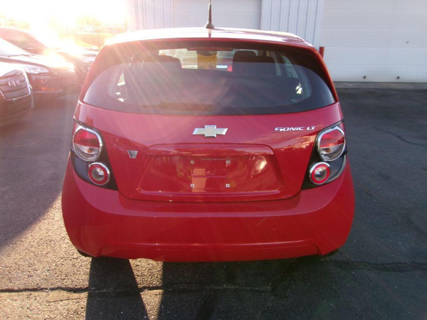 2013 RED CHEVROLET SONIC LT (1G1JC6SH7D4) with an 1.8L engine, Automatic transmission, located at 501 E. Columbia St., Springfield, OH, 45503, (800) 262-7122, 39.925262, -83.801796 - *** New Tires *** LT *** New Brakes *** New Wipers *** Serviced and Detailed *** Jay North Auto has offered hand picked vehicles since 1965! Our customer's enjoy a NO pressure buying experience with a small town feel. All of our vehicles get fully inspected and detailed. We are a preferred deal - Photo#4