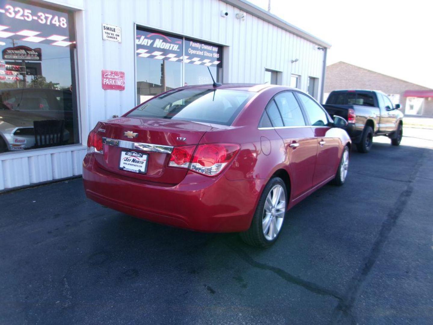 2014 RED CHEVROLET CRUZE LTZ (1G1PG5SB1E7) with an 1.4L engine, Automatic transmission, located at 501 E. Columbia St., Springfield, OH, 45503, (800) 262-7122, 39.925262, -83.801796 - *** LOW MILES *** LTZ *** Remote Start *** Leather *** New Brakes *** Like New Tires *** Serviced and Detailed *** Jay North Auto has offered hand picked vehicles since 1965! Our customer's enjoy a NO pressure buying experience with a small town feel. All of our vehicles get fully inspected and - Photo#3