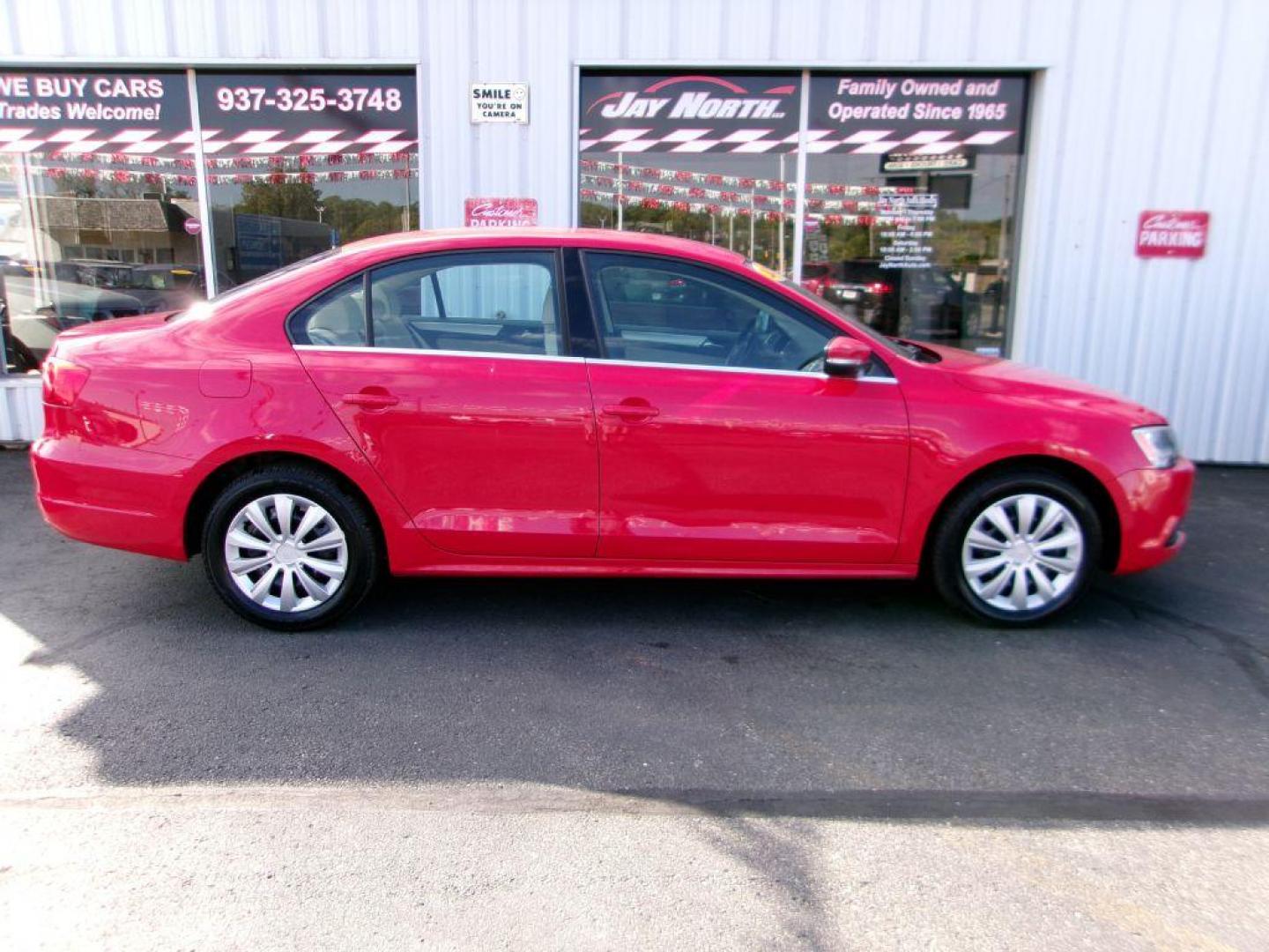 2013 RED VOLKSWAGEN JETTA SE (3VWDP7AJ9DM) with an 2.5L engine, Automatic transmission, located at 501 E. Columbia St., Springfield, OH, 45503, (800) 262-7122, 39.925262, -83.801796 - *** New Tires *** Tune Up *** New Brakes *** SE 2.5L *** Serviced and Detailed *** Leather *** Jay North Auto has offered hand picked vehicles since 1965! Our customer's enjoy a NO pressure buying experience with a small town feel. All of our vehicles get fully inspected and detailed. We are a - Photo#0