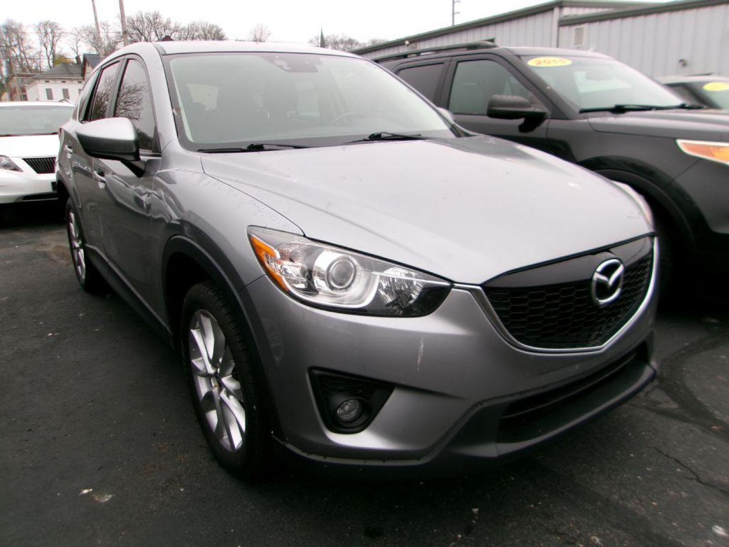 2014 SILVER MAZDA CX-5 GRAND TOURING (JM3KE4DY2E0) with an 2.5L engine, Automatic transmission, located at 501 E. Columbia St., Springfield, OH, 45503, (800) 262-7122, 39.925262, -83.801796 - ***1-Owner***Clean Carfax***New Front Brake Pads and Rotors***New Battery***New Spark Plugs***New Cabin Filter***AWD***Grand Touring***Detailed and Ready To Go*** Jay North Auto has offered hand picked vehicles since 1965! Our customer's enjoy a NO pressure buying experience with a small town - Photo#2
