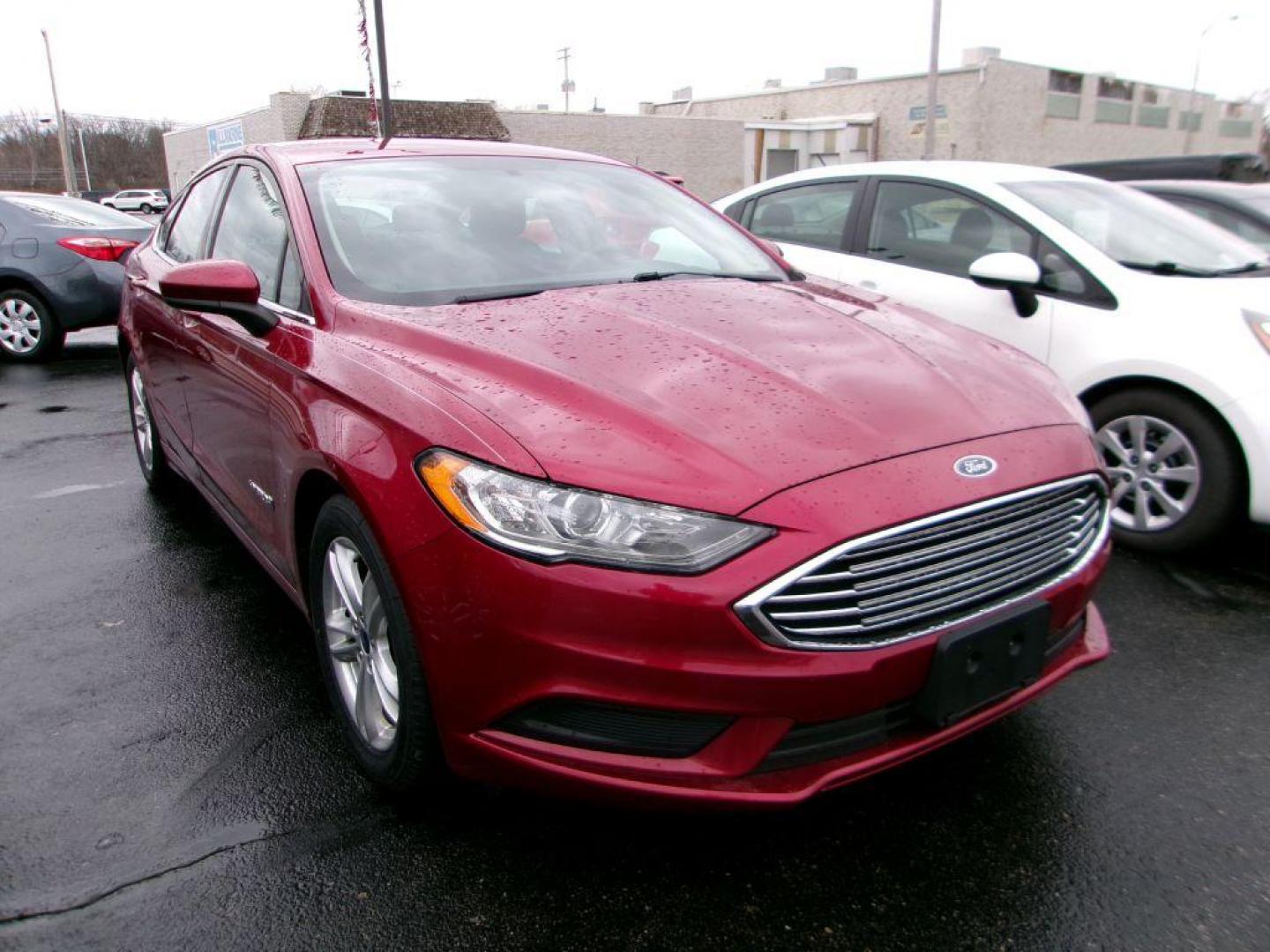 2018 RED FORD FUSION SE HYBRID (3FA6P0LU3JR) with an 2.0L engine, Continuously Variable transmission, located at 501 E. Columbia St., Springfield, OH, 45503, (800) 262-7122, 39.925262, -83.801796 - ***Clean Carfax***New Tires***New Front and Rear Brakes***New Air Filter and Cabin Air Filter***New Wiper Blades***HYBRID***Heated Seats***Fresh Oil Change***Ready To Go*** Jay North Auto has offered hand picked vehicles since 1965! Our customer's enjoy a NO pressure buying experience with a s - Photo#0