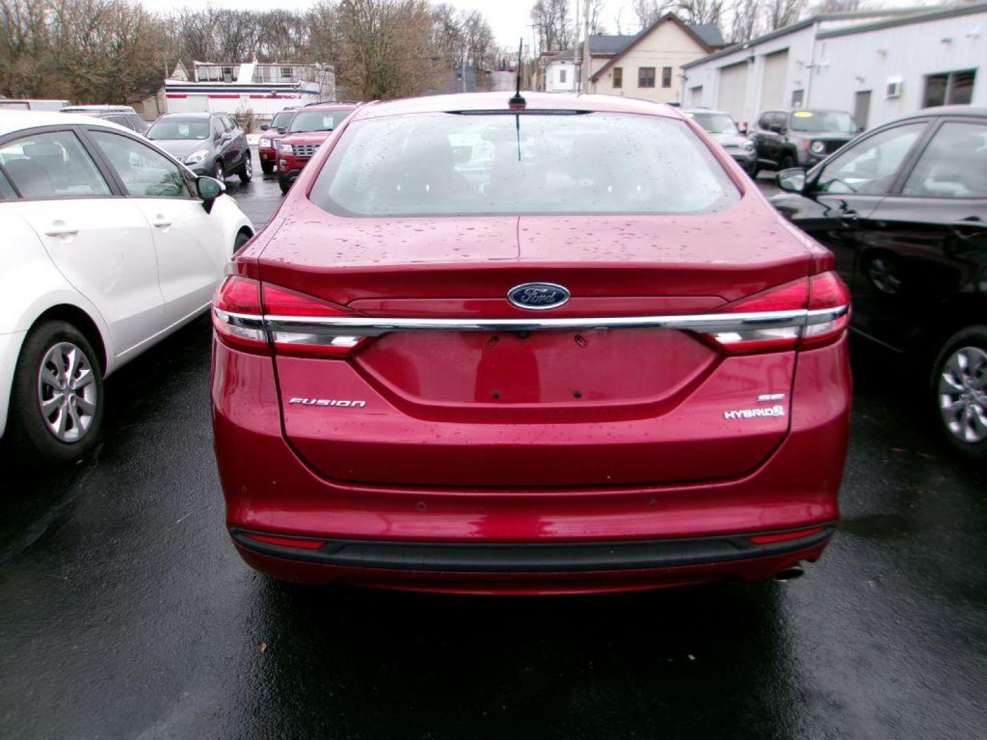 2018 RED FORD FUSION SE HYBRID (3FA6P0LU3JR) with an 2.0L engine, Continuously Variable transmission, located at 501 E. Columbia St., Springfield, OH, 45503, (800) 262-7122, 39.925262, -83.801796 - ***Clean Carfax***New Tires***New Front and Rear Brakes***New Air Filter and Cabin Air Filter***New Wiper Blades***HYBRID***Heated Seats***Fresh Oil Change***Ready To Go*** Jay North Auto has offered hand picked vehicles since 1965! Our customer's enjoy a NO pressure buying experience with a s - Photo#3