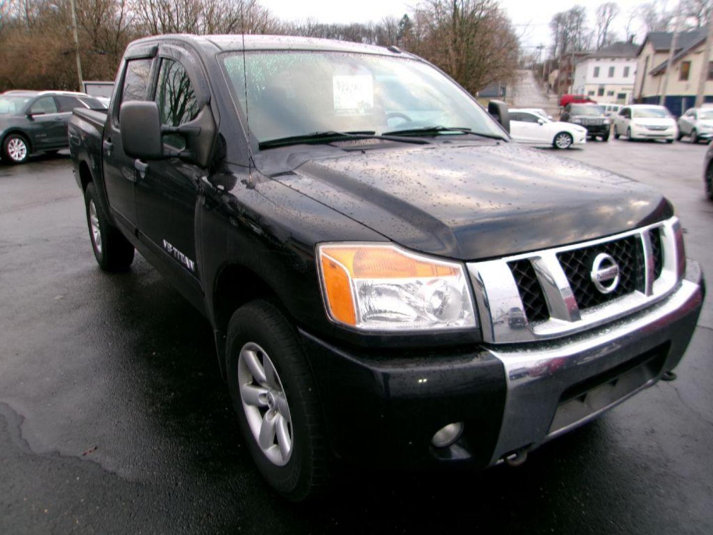 2011 BLACK NISSAN TITAN SV (1N6AA0EC4BN) with an 5.6L engine, Automatic transmission, located at 501 E. Columbia St., Springfield, OH, 45503, (800) 262-7122, 39.925262, -83.801796 - *** SV *** 4WD *** 5.6L V8 *** Crew Cab *** New Brakes *** New Air and Cabin Filter *** Nice!!! *** Jay North Auto has offered hand picked vehicles since 1965! Our customer's enjoy a NO pressure buying experience with a small town feel. We are a preferred dealer for many local credit unions an - Photo#0