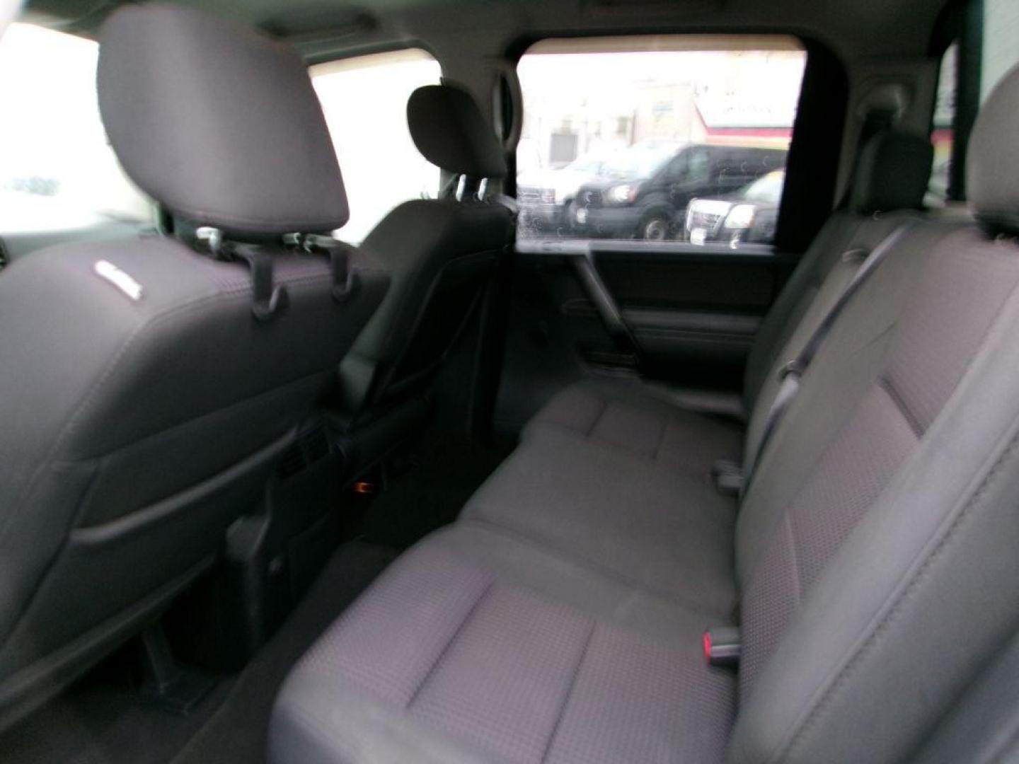 2011 BLACK NISSAN TITAN SV (1N6AA0EC4BN) with an 5.6L engine, Automatic transmission, located at 501 E. Columbia St., Springfield, OH, 45503, (800) 262-7122, 39.925262, -83.801796 - *** SV *** 4WD *** 5.6L V8 *** Crew Cab *** New Brakes *** New Air and Cabin Filter *** Nice!!! *** Jay North Auto has offered hand picked vehicles since 1965! Our customer's enjoy a NO pressure buying experience with a small town feel. We are a preferred dealer for many local credit unions an - Photo#5