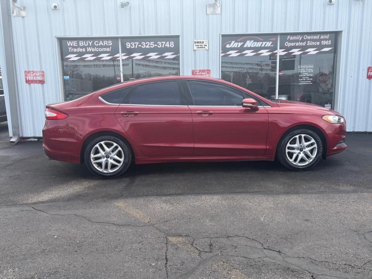 2014 RED FORD FUSION SE (3FA6P0H73ER) with an 2.5L engine, Automatic transmission, located at 501 E. Columbia St., Springfield, OH, 45503, (800) 262-7122, 39.925262, -83.801796 - ***Clean Carfax***New Tires***New Front and Rear Brakes***New Air Filter and Cabin Air Filter***New Spark Plugs***Fresh Oil Change***Detailed and Ready To Go*** Jay North Auto has offered hand picked vehicles since 1965! Our customer's enjoy a NO pressure buying experience with a small town fe - Photo#1
