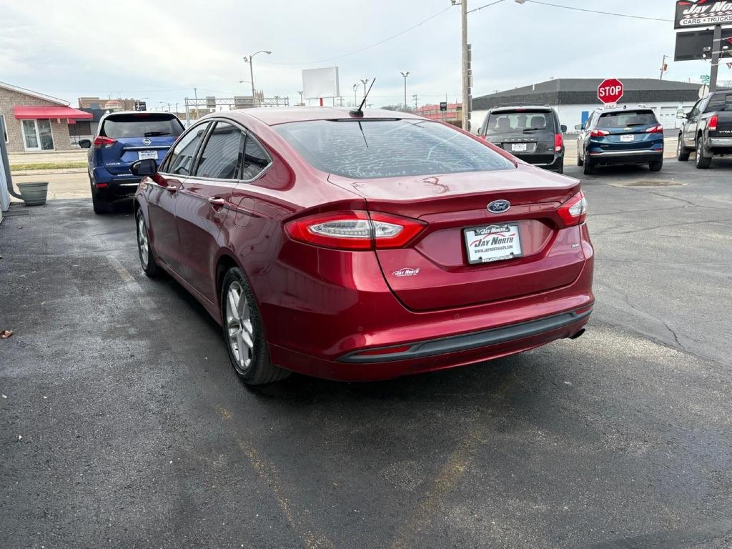 2014 RED FORD FUSION SE (3FA6P0H73ER) with an 2.5L engine, Automatic transmission, located at 501 E. Columbia St., Springfield, OH, 45503, (800) 262-7122, 39.925262, -83.801796 - ***Clean Carfax***New Tires***New Front and Rear Brakes***New Air Filter and Cabin Air Filter***New Spark Plugs***Fresh Oil Change***Detailed and Ready To Go*** Jay North Auto has offered hand picked vehicles since 1965! Our customer's enjoy a NO pressure buying experience with a small town fe - Photo#4