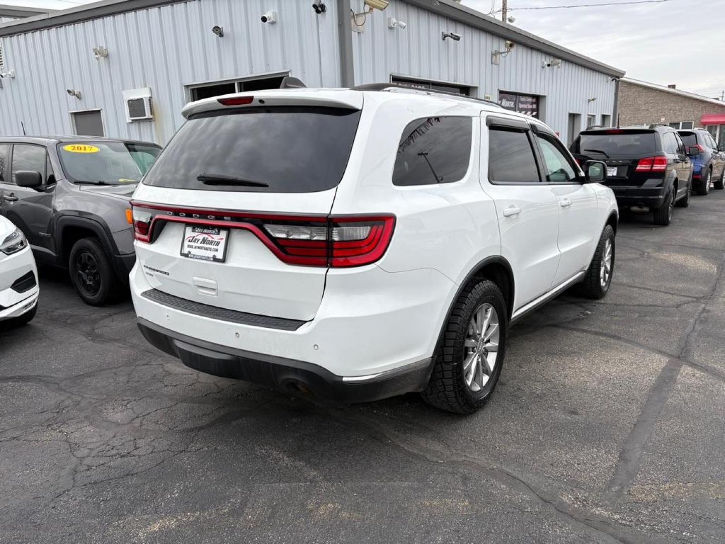 2017 WHITE DODGE DURANGO SXT (1C4RDJAG1HC) with an 3.6L engine, Automatic transmission, located at 501 E. Columbia St., Springfield, OH, 45503, (800) 262-7122, 39.925262, -83.801796 - *** Clean CarFax w/ 18 Service Records *** New Tires *** New Rear Shocks *** New Air and Cabin Filter *** Moonroof *** Tow Package *** Heated Seats and Steering Wheel *** 3rd row seating *** All Wheel Drive *** Park Assist w/ Back Up Camera *** Jay North Auto has offered hand picked vehicles sin - Photo#2