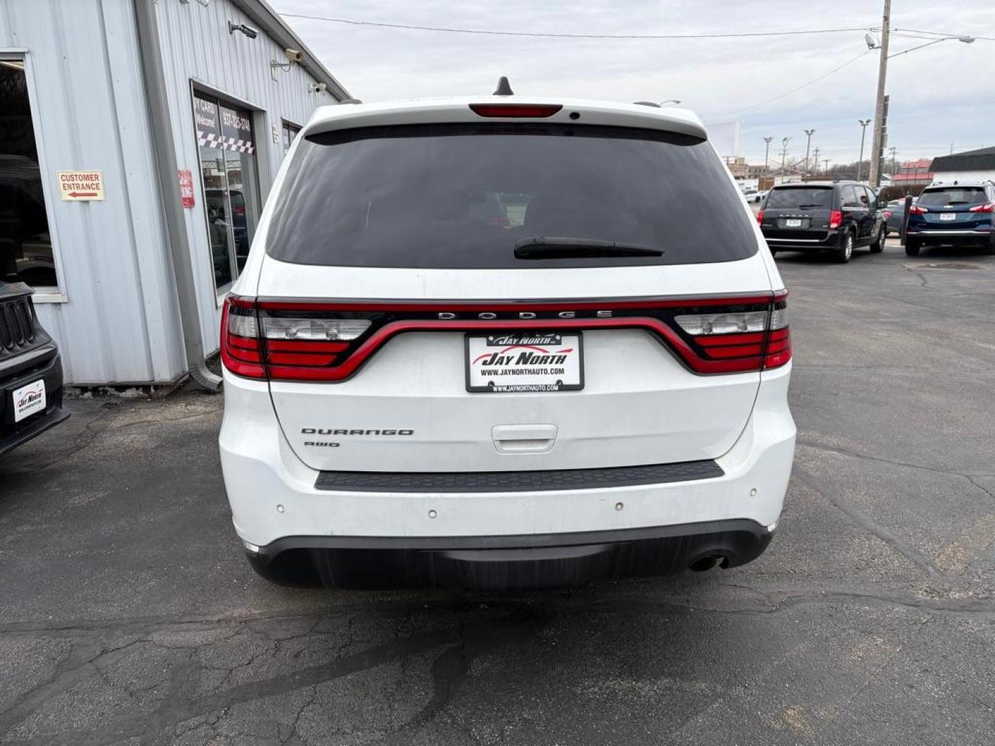 2017 WHITE DODGE DURANGO SXT (1C4RDJAG1HC) with an 3.6L engine, Automatic transmission, located at 501 E. Columbia St., Springfield, OH, 45503, (800) 262-7122, 39.925262, -83.801796 - *** Clean CarFax w/ 18 Service Records *** New Tires *** New Rear Shocks *** New Air and Cabin Filter *** Moonroof *** Tow Package *** Heated Seats and Steering Wheel *** 3rd row seating *** All Wheel Drive *** Park Assist w/ Back Up Camera *** Jay North Auto has offered hand picked vehicles sin - Photo#3