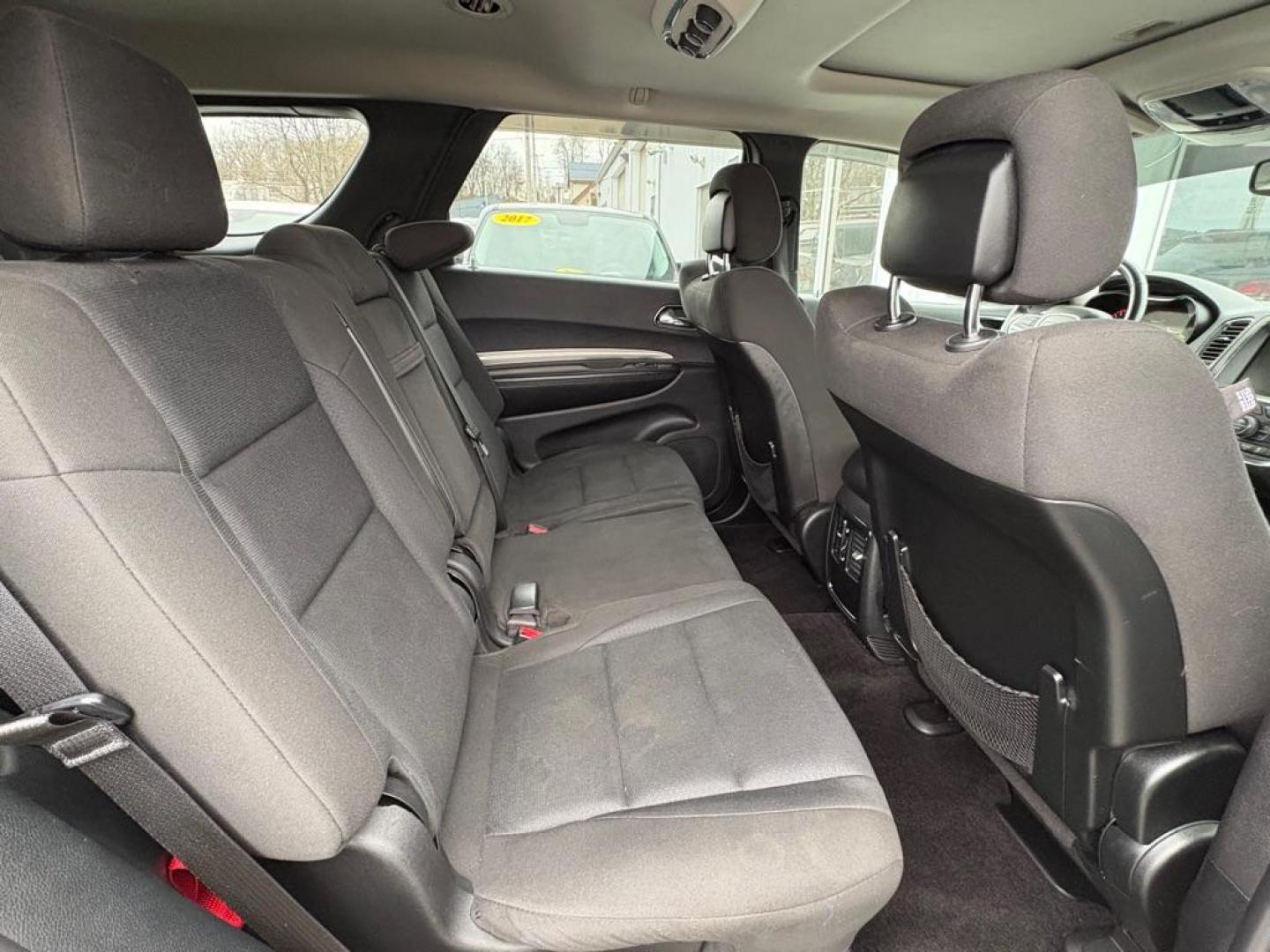 2017 WHITE DODGE DURANGO SXT (1C4RDJAG1HC) with an 3.6L engine, Automatic transmission, located at 501 E. Columbia St., Springfield, OH, 45503, (800) 262-7122, 39.925262, -83.801796 - *** Clean CarFax w/ 18 Service Records *** New Tires *** New Rear Shocks *** New Air and Cabin Filter *** Moonroof *** Tow Package *** Heated Seats and Steering Wheel *** 3rd row seating *** All Wheel Drive *** Park Assist w/ Back Up Camera *** Jay North Auto has offered hand picked vehicles sin - Photo#16