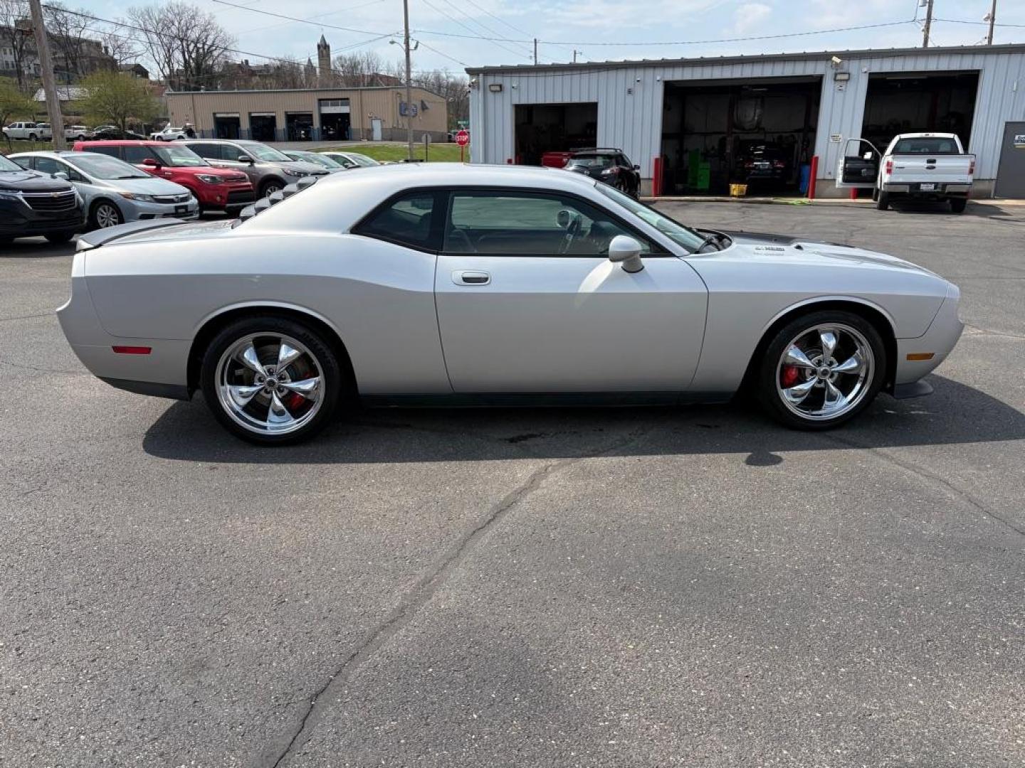 2009 SILVER DODGE CHALLENGER SRT-8 (2B3LJ74W59H) with an 6.1L engine, 6-Speed Manual transmission, located at 501 E. Columbia St., Springfield, OH, 45503, (800) 262-7122, 39.925262, -83.801796 - *** SRT 8 *** 6.1L *** Loaded *** 6 Speed Manual *** RWD *** Clean CarFax *** Oil and Filter Chage *** Cabin and Air filter *** Custom Wheels *** Jay North Auto has offered hand picked vehicles since 1965! Our customer's enjoy a NO pressure buying experience with a small town feel. We are a pr - Photo#1