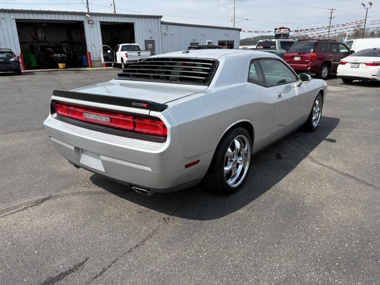 2009 SILVER DODGE CHALLENGER SRT-8 (2B3LJ74W59H) with an 6.1L engine, 6-Speed Manual transmission, located at 501 E. Columbia St., Springfield, OH, 45503, (800) 262-7122, 39.925262, -83.801796 - *** SRT 8 *** 6.1L *** Loaded *** 6 Speed Manual *** RWD *** Clean CarFax *** Oil and Filter Chage *** Cabin and Air filter *** Custom Wheels *** Jay North Auto has offered hand picked vehicles since 1965! Our customer's enjoy a NO pressure buying experience with a small town feel. We are a pr - Photo#2