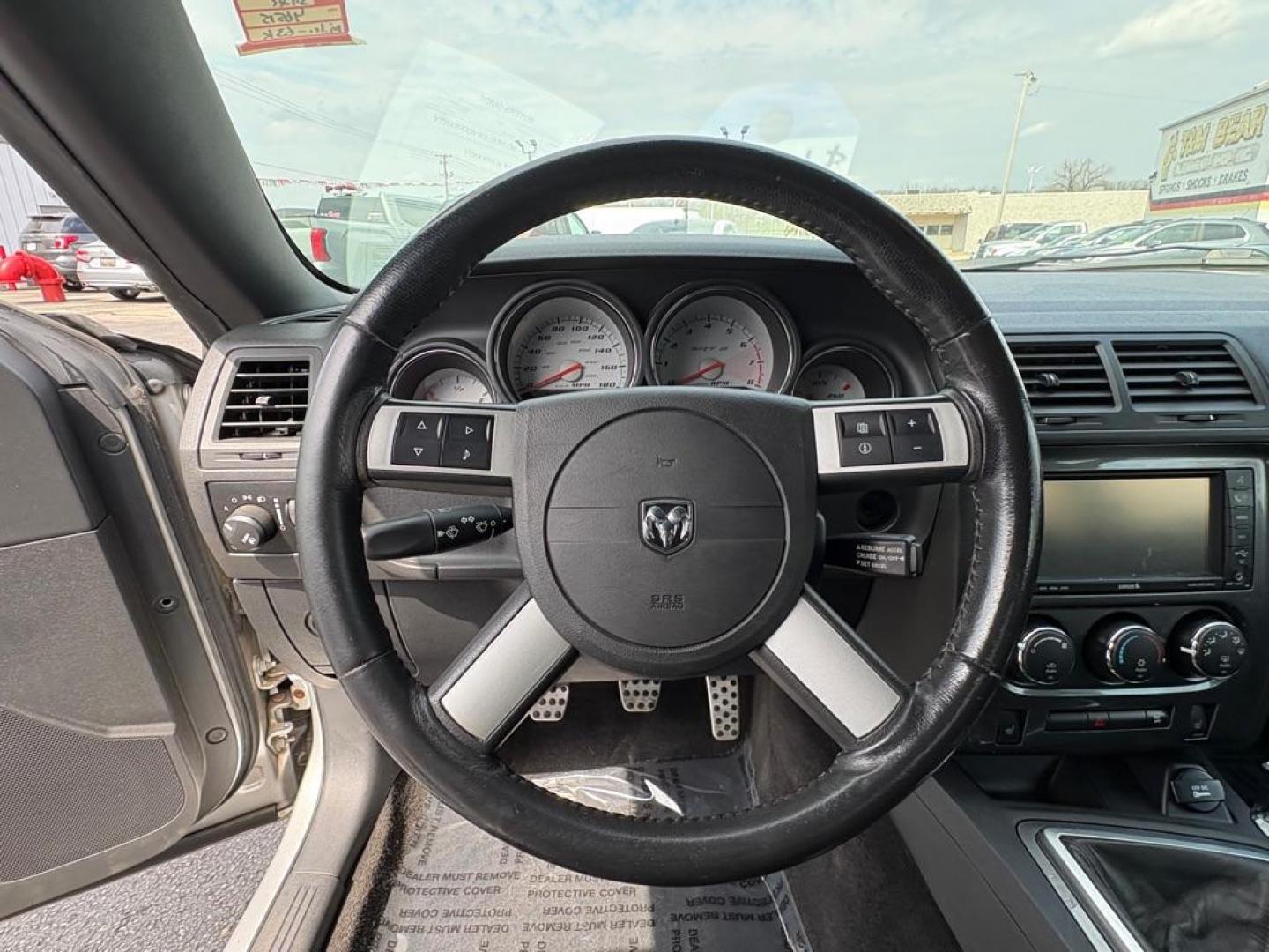 2009 SILVER DODGE CHALLENGER SRT-8 (2B3LJ74W59H) with an 6.1L engine, 6-Speed Manual transmission, located at 501 E. Columbia St., Springfield, OH, 45503, (800) 262-7122, 39.925262, -83.801796 - *** SRT 8 *** 6.1L *** Loaded *** 6 Speed Manual *** RWD *** Clean CarFax *** Oil and Filter Chage *** Cabin and Air filter *** Custom Wheels *** Jay North Auto has offered hand picked vehicles since 1965! Our customer's enjoy a NO pressure buying experience with a small town feel. We are a pr - Photo#17