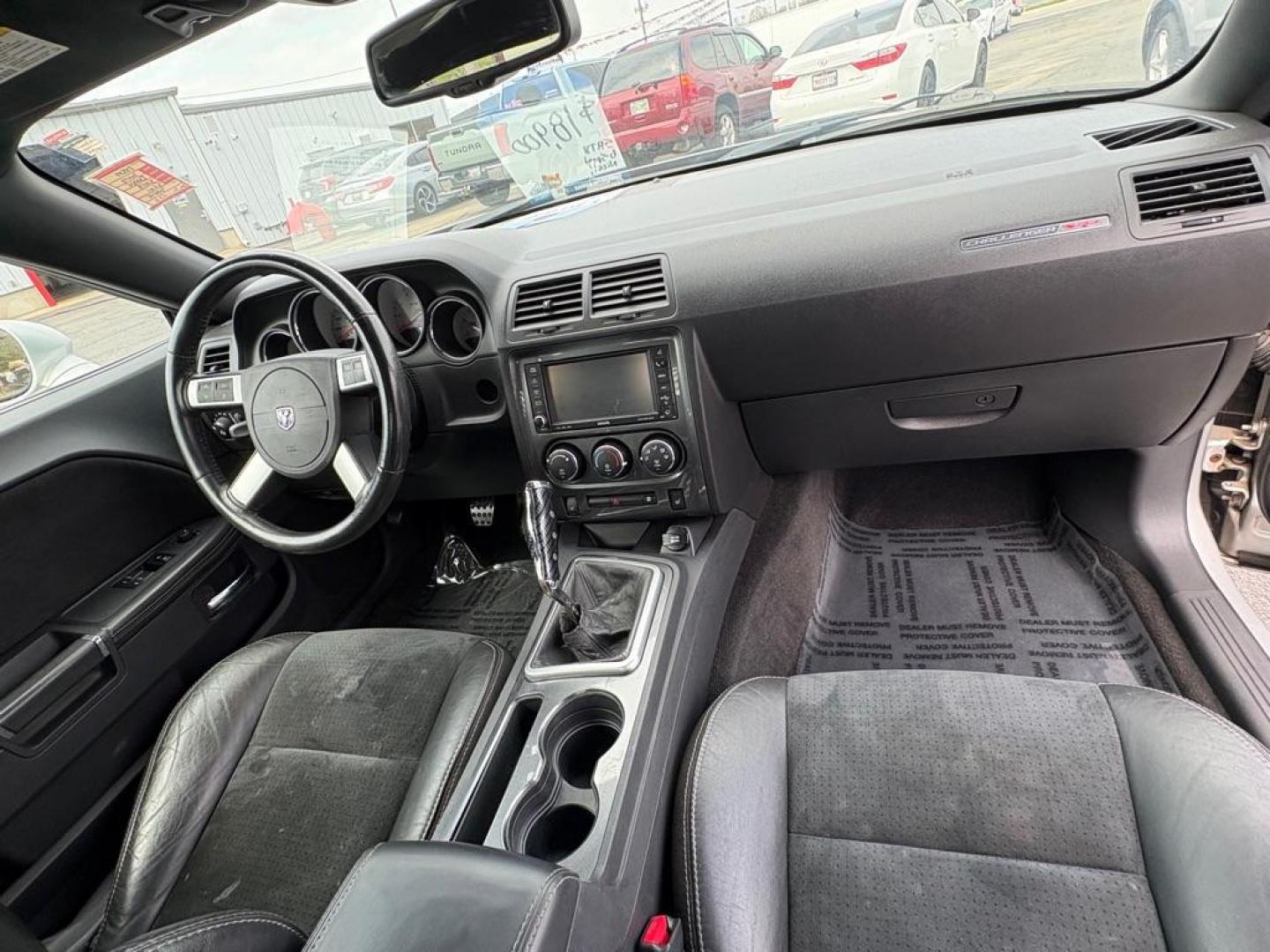2009 SILVER DODGE CHALLENGER SRT-8 (2B3LJ74W59H) with an 6.1L engine, 6-Speed Manual transmission, located at 501 E. Columbia St., Springfield, OH, 45503, (800) 262-7122, 39.925262, -83.801796 - *** SRT 8 *** 6.1L *** Loaded *** 6 Speed Manual *** RWD *** Clean CarFax *** Oil and Filter Chage *** Cabin and Air filter *** Custom Wheels *** Jay North Auto has offered hand picked vehicles since 1965! Our customer's enjoy a NO pressure buying experience with a small town feel. We are a pr - Photo#24