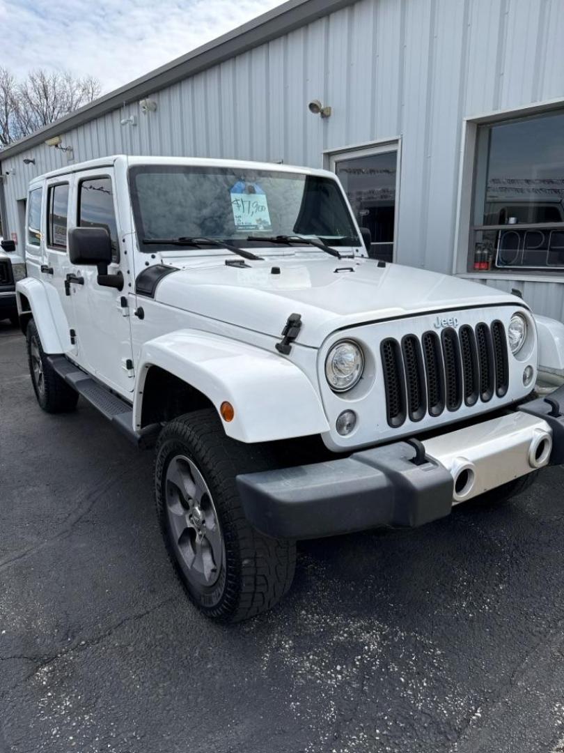 2018 WHITE JEEP WRANGLER UNLIMI SAHARA (1C4BJWEGXJL) with an 3.6L engine, Automatic transmission, located at 501 E. Columbia St., Springfield, OH, 45503, (800) 262-7122, 39.925262, -83.801796 - *** Wrangler limited Sahara *** 4x4 *** V6 *** Clean CarFax *** OPTIONAL EQUIPMENT *** Bright White Clear Coat Exterior Paint Fine Silver Metallic Bumper Accents Sahara Package 24G Body-Color Gr - Photo#1