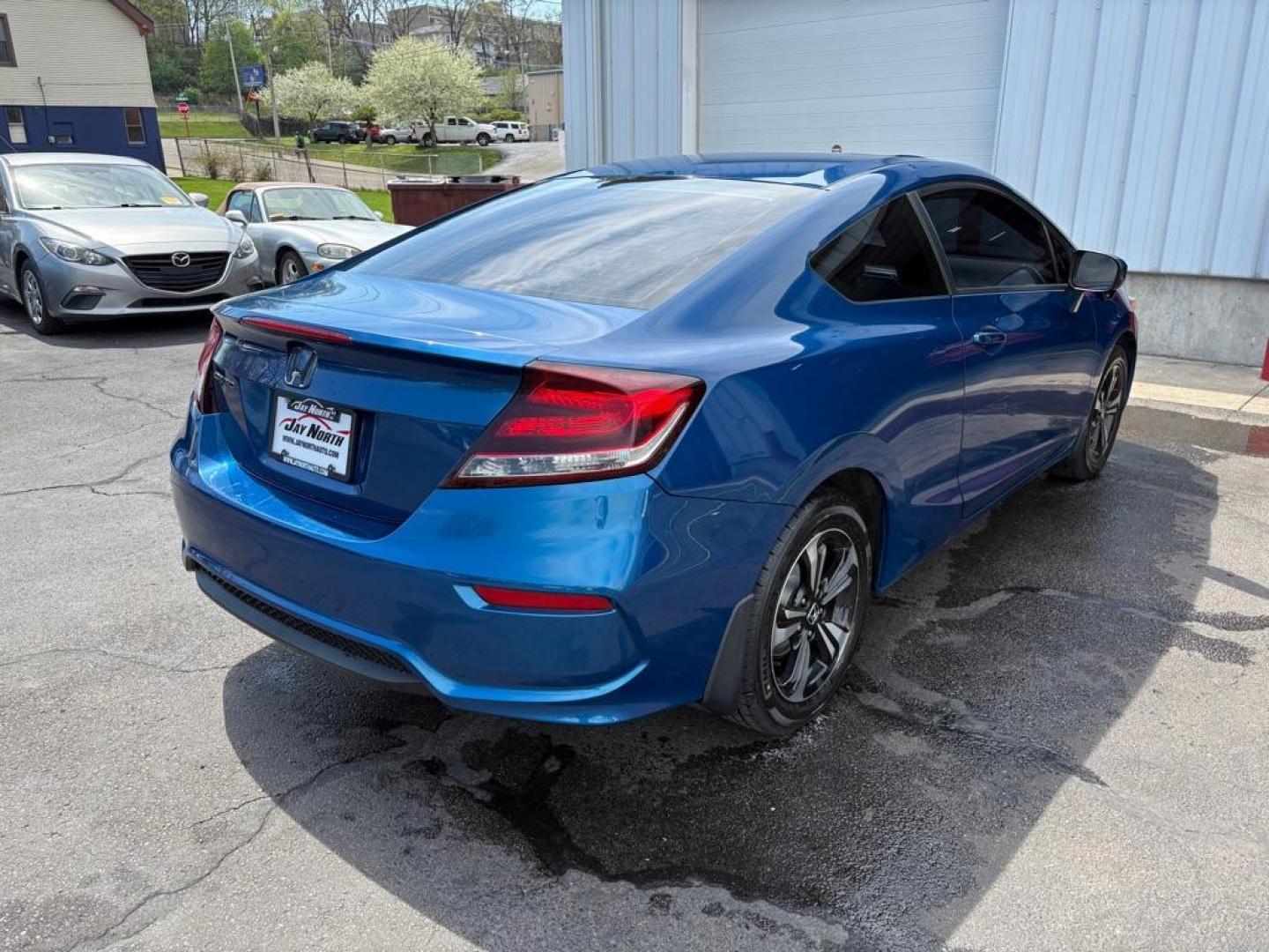 2015 BLUE HONDA CIVIC EX (2HGFG3A8XFH) with an 1.8L engine, 5-Speed Manual transmission, located at 501 E. Columbia St., Springfield, OH, 45503, (800) 262-7122, 39.925262, -83.801796 - ***Price Includes Dealer Documentation Fee!***EX***Coupe***5-Speed***Moonroof***New Battery***All New Brake Pads and Rotors***New Cabin Air Filter***Fresh Oil Change*** Jay North Auto has offered hand picked vehicles since 1965! Our customer's enjoy a NO pressure buying experience with a small - Photo#2