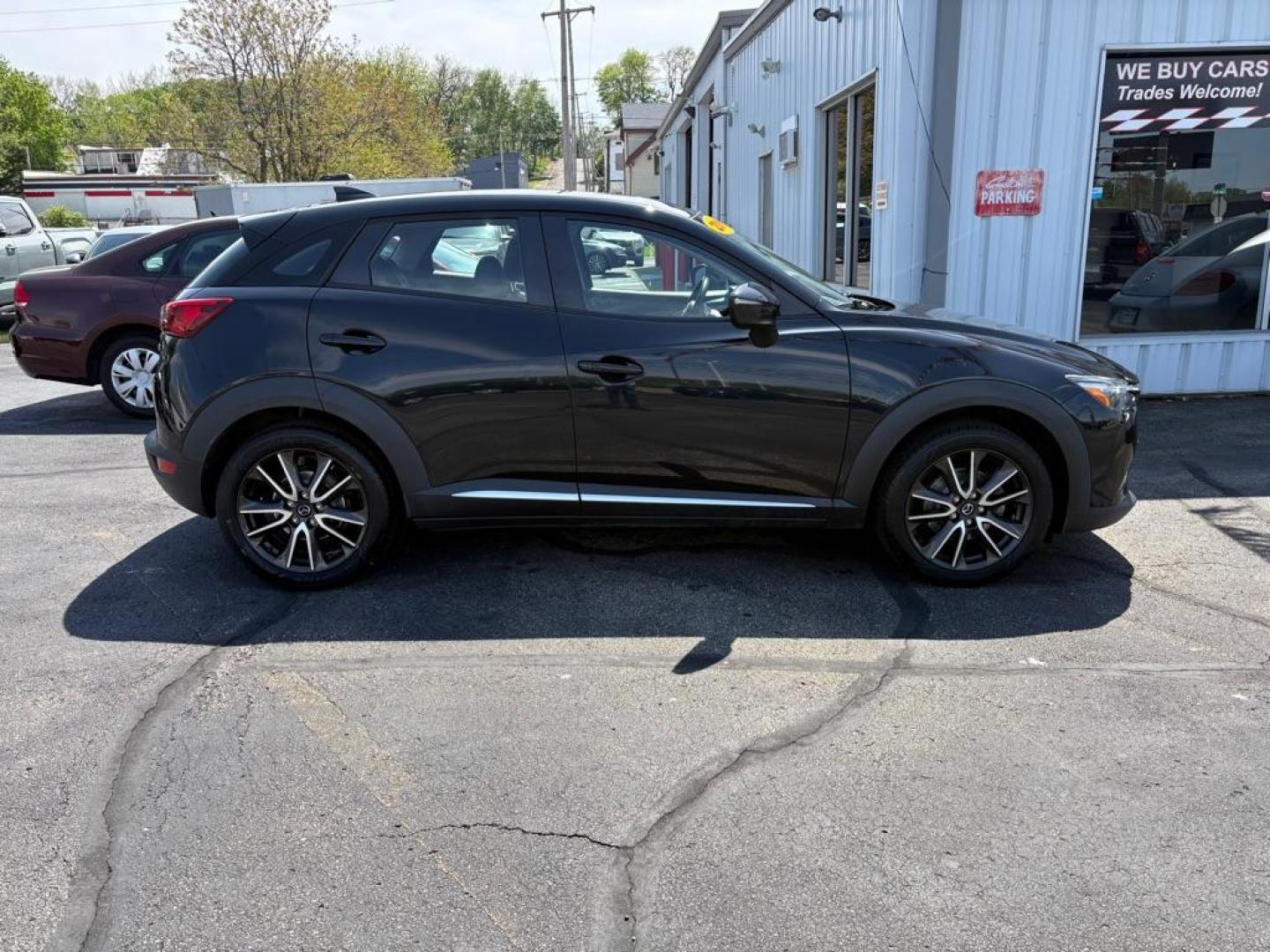 2016 BLACK MAZDA CX-3 GRAND TOURING (JM1DKBD76G0) with an 2.0L engine, Automatic transmission, located at 501 E. Columbia St., Springfield, OH, 45503, (800) 262-7122, 39.925262, -83.801796 - *** Clean CarFax *** Tune Up *** Newer Tires *** New Wipers *** New Brakes *** Oil Change ** Cabin and Air filters *** Inspection *** Back Up Camera *** Heated Seats *** Premium Audio *** Jay North Auto has offered hand picked vehicles since 1965! Our customer's enjoy a NO pressure buying experi - Photo#1