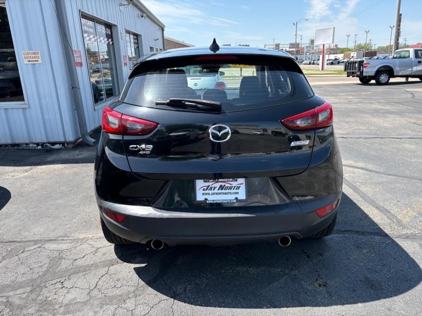 2016 BLACK MAZDA CX-3 GRAND TOURING (JM1DKBD76G0) with an 2.0L engine, Automatic transmission, located at 501 E. Columbia St., Springfield, OH, 45503, (800) 262-7122, 39.925262, -83.801796 - *** Clean CarFax *** Tune Up *** Newer Tires *** New Wipers *** New Brakes *** Oil Change ** Cabin and Air filters *** Inspection *** Back Up Camera *** Heated Seats *** Premium Audio *** Jay North Auto has offered hand picked vehicles since 1965! Our customer's enjoy a NO pressure buying experi - Photo#3
