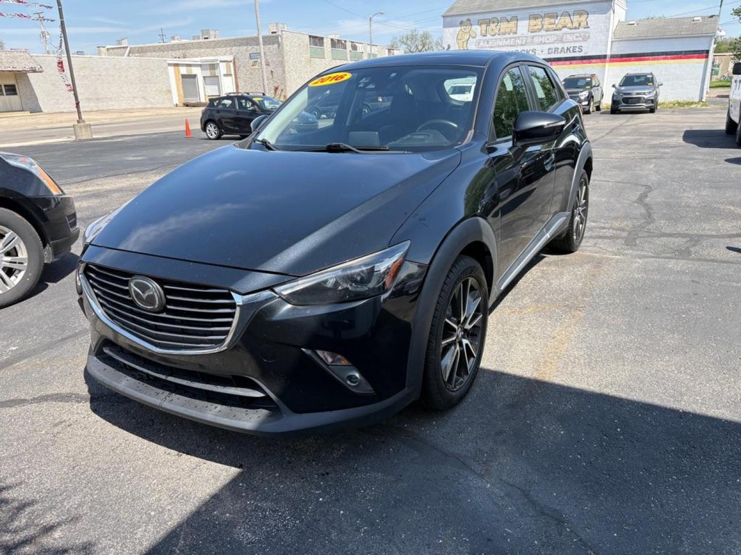 2016 BLACK MAZDA CX-3 GRAND TOURING (JM1DKBD76G0) with an 2.0L engine, Automatic transmission, located at 501 E. Columbia St., Springfield, OH, 45503, (800) 262-7122, 39.925262, -83.801796 - *** Clean CarFax *** Tune Up *** Newer Tires *** New Wipers *** New Brakes *** Oil Change ** Cabin and Air filters *** Inspection *** Back Up Camera *** Heated Seats *** Premium Audio *** Jay North Auto has offered hand picked vehicles since 1965! Our customer's enjoy a NO pressure buying experi - Photo#5