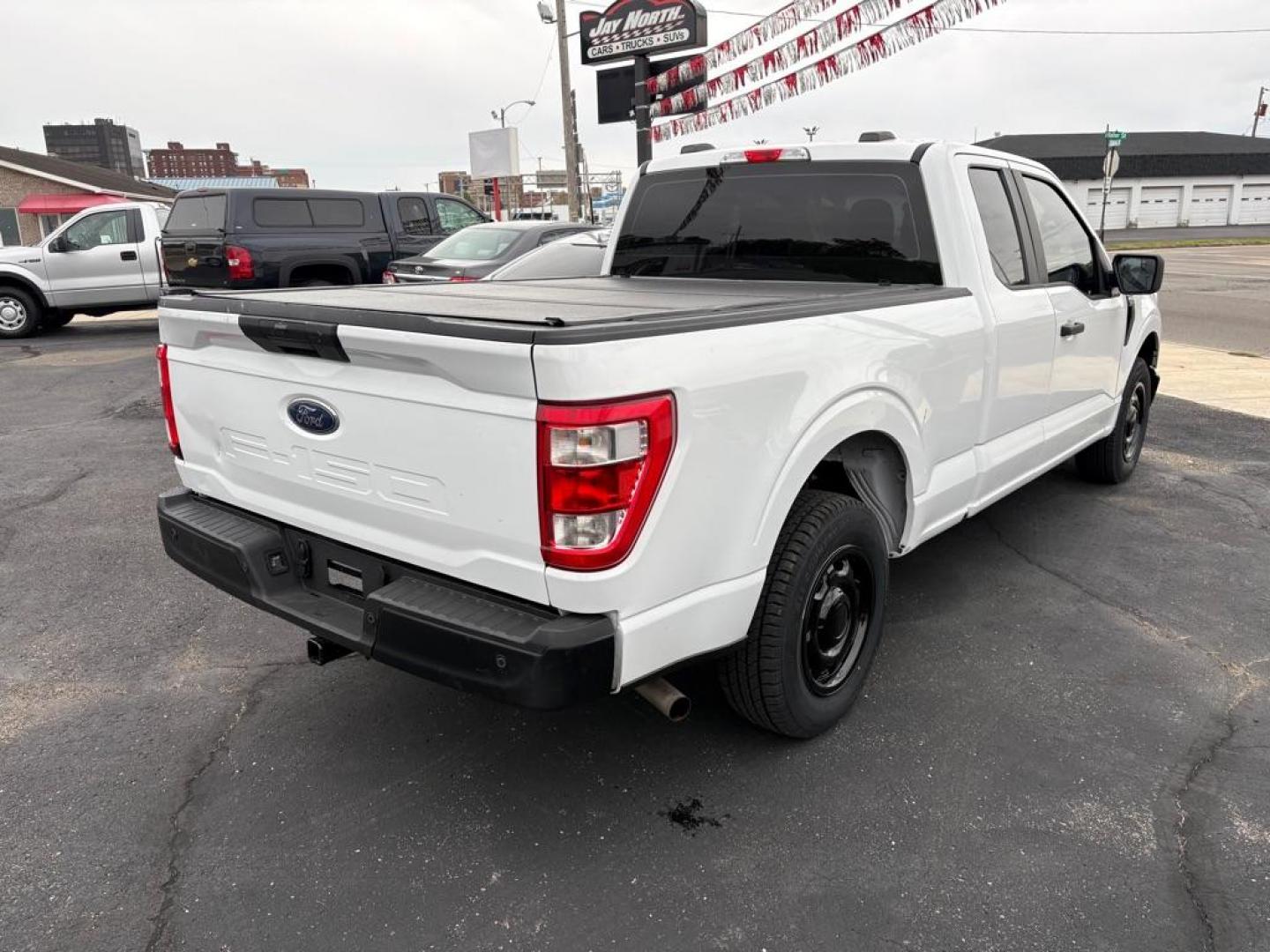 2022 WHITE FORD F150 SUPER CAB (1FTEX1CB7NF) with an 3.3L engine, Automatic transmission, located at 501 E. Columbia St., Springfield, OH, 45503, (800) 262-7122, 39.925262, -83.801796 - *** XL V6 *** Clean CarFax *** New Tires *** New Brakes *** Oil Change *** New Cabin and Air filter *** Hard Bed Cover *** Jay North Auto has offered hand picked vehicles since 1965! Our customer's enjoy a NO pressure buying experience with a small town feel. We are a preferred dealer for ma - Photo#2