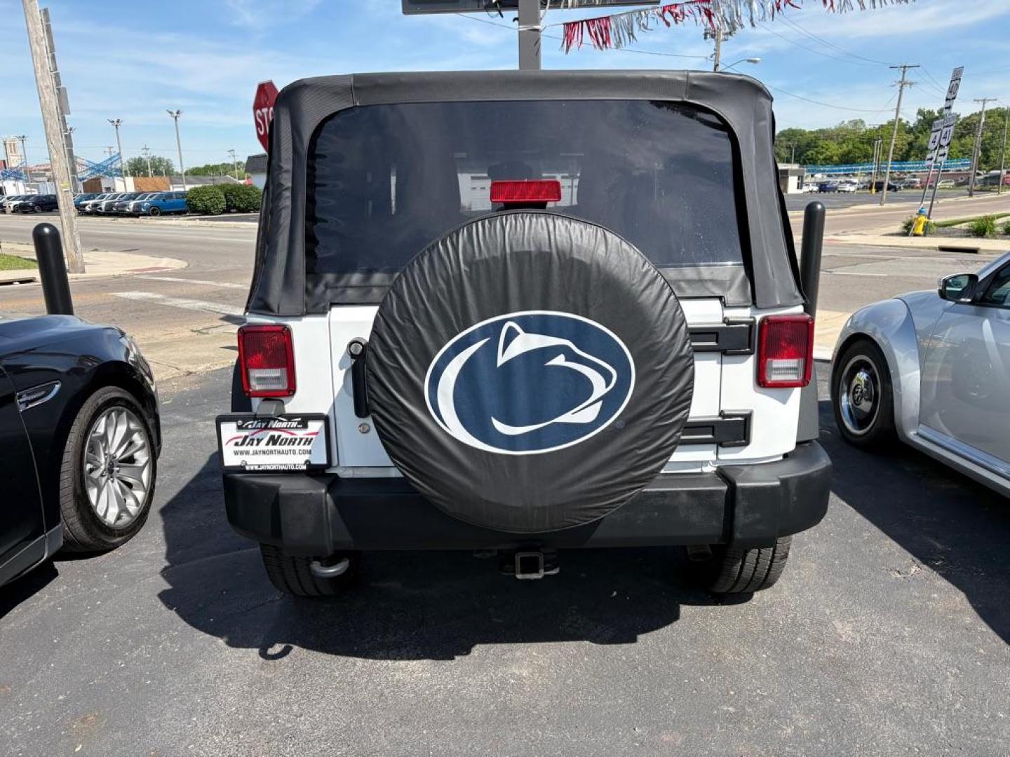 2014 WHITE JEEP WRANGLER SPORT (1C4AJWAG6EL) with an 3.6L engine, 6-Speed Manual transmission, located at 501 E. Columbia St., Springfield, OH, 45503, (800) 262-7122, 39.925262, -83.801796 - *** 1 Owner *** New Top w/ tint *** Sport *** Oil Change *** Inspection *** New Wipers *** Air filter *** NICE *** V6 *** 4x4 *** Jay North Auto has offered hand picked vehicles since 1965! Our customer's enjoy a NO pressure buying experience with a small town feel. We are a preferred dealer f - Photo#2