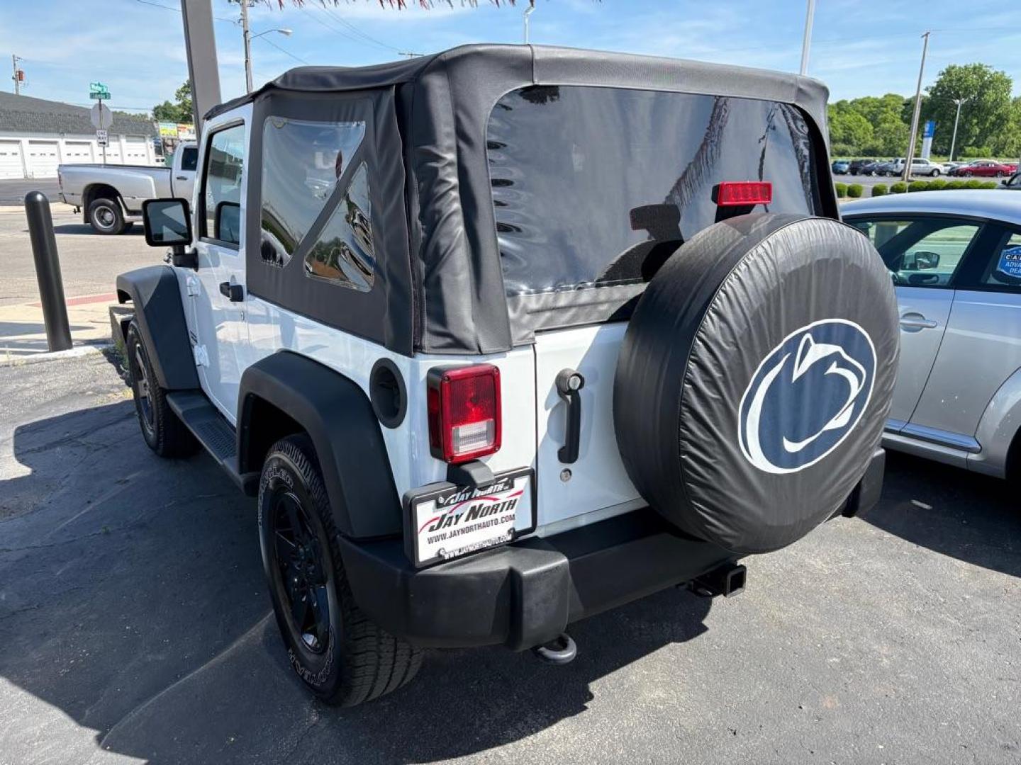 2014 WHITE JEEP WRANGLER SPORT (1C4AJWAG6EL) with an 3.6L engine, 6-Speed Manual transmission, located at 501 E. Columbia St., Springfield, OH, 45503, (800) 262-7122, 39.925262, -83.801796 - *** 1 Owner *** New Top w/ tint *** Sport *** Oil Change *** Inspection *** New Wipers *** Air filter *** NICE *** V6 *** 4x4 *** Jay North Auto has offered hand picked vehicles since 1965! Our customer's enjoy a NO pressure buying experience with a small town feel. We are a preferred dealer f - Photo#3