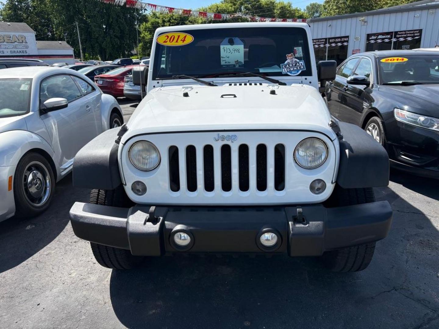 2014 WHITE JEEP WRANGLER SPORT (1C4AJWAG6EL) with an 3.6L engine, 6-Speed Manual transmission, located at 501 E. Columbia St., Springfield, OH, 45503, (800) 262-7122, 39.925262, -83.801796 - *** 1 Owner *** New Top w/ tint *** Sport *** Oil Change *** Inspection *** New Wipers *** Air filter *** NICE *** V6 *** 4x4 *** Jay North Auto has offered hand picked vehicles since 1965! Our customer's enjoy a NO pressure buying experience with a small town feel. We are a preferred dealer f - Photo#5
