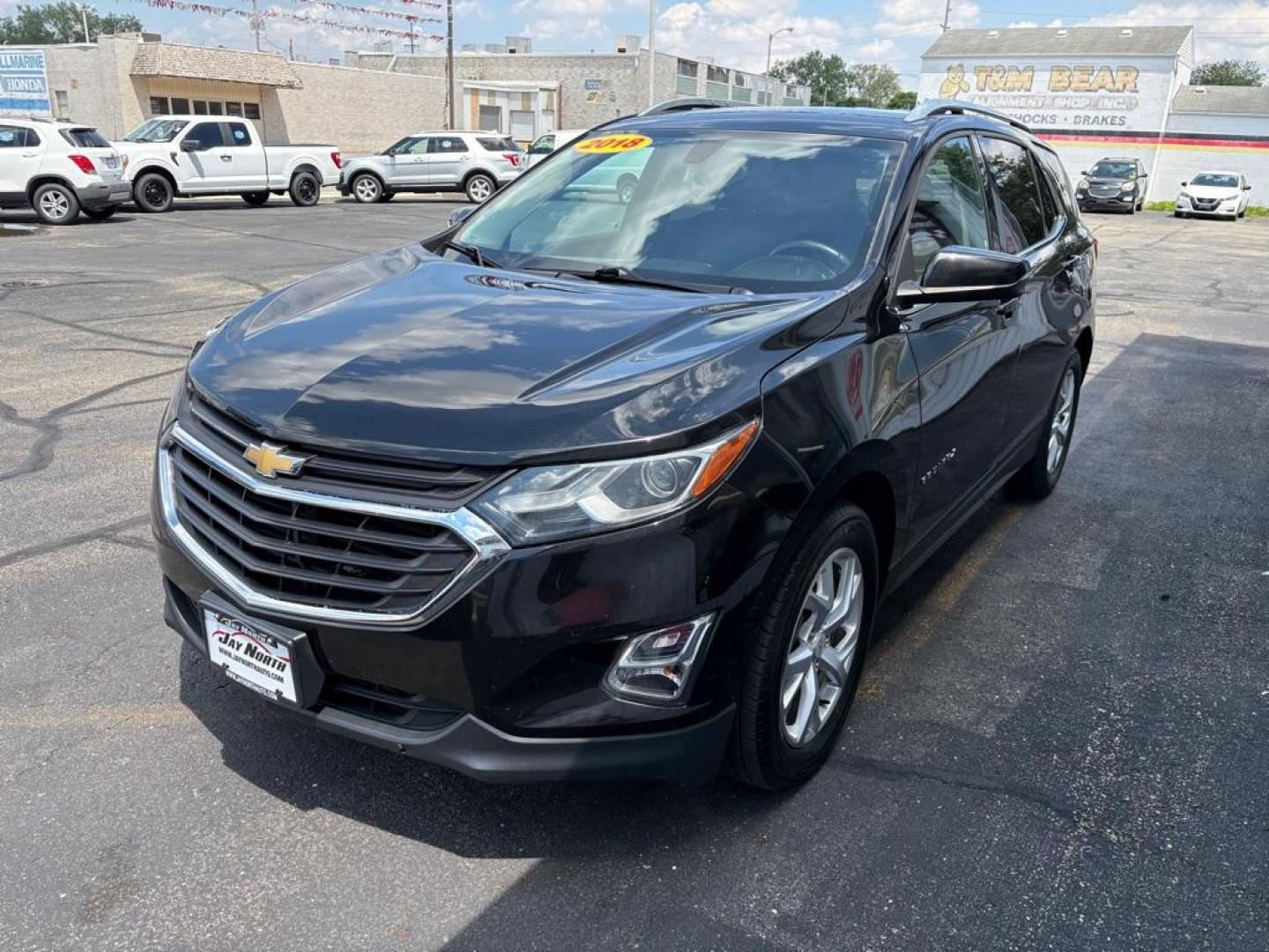 2018 BLACK CHEVROLET EQUINOX LT (2GNAXTEX0J6) with an 2.0L engine, Automatic transmission, located at 501 E. Columbia St., Springfield, OH, 45503, (800) 262-7122, 39.925262, -83.801796 - ***Clean Carfax***LT***Heated Seats***Power Liftgate***Remote Start***New Tires***All New Brake Pads and Rotors***New Spark Plugs***New Air Filter and Cabin Air Filter***New Wiper Blades***Fresh Oil Change*** Jay North Auto has offered hand picked vehicles since 1965! Our customer's enjoy a NO - Photo#5
