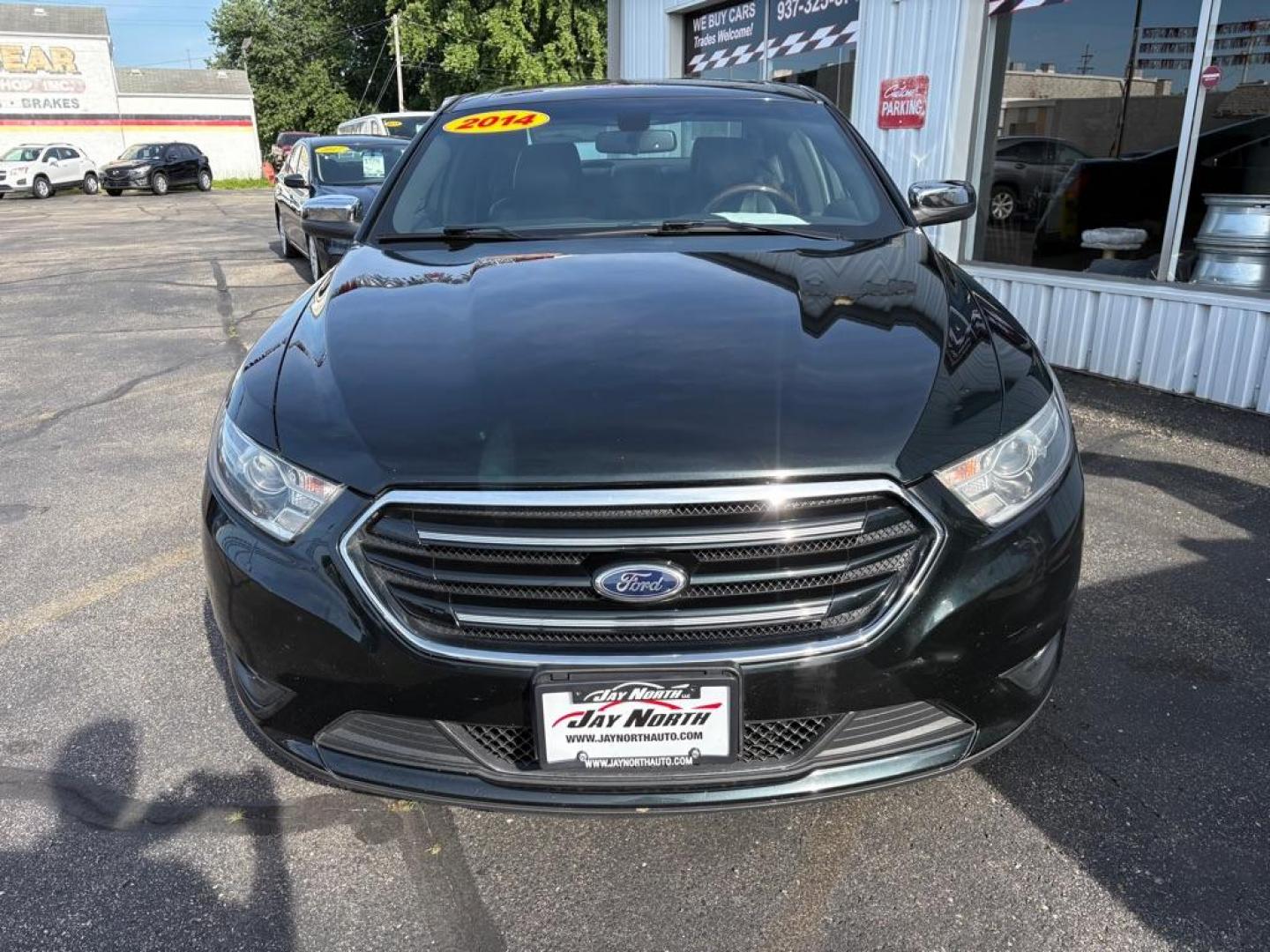 2014 BLACK FORD TAURUS LIMITED (1FAHP2F86EG) with an 3.5L engine, Automatic transmission, located at 501 E. Columbia St., Springfield, OH, 45503, (800) 262-7122, 39.925262, -83.801796 - *** New Front Brakes *** Oil Change *** New Wipers *** New Air and Cabin filter *** New Belt *** Inspection *** V6 *** Leather *** Back Up Camera *** Premium Audio w/ Touchscreen Navigation *** NICE *** FWD *** Alloy Wheels *** Jay North Auto has offered hand picked vehicles since 1965! Our cu - Photo#6