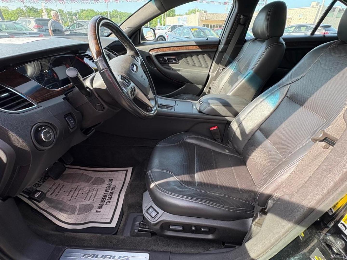 2014 BLACK FORD TAURUS LIMITED (1FAHP2F86EG) with an 3.5L engine, Automatic transmission, located at 501 E. Columbia St., Springfield, OH, 45503, (800) 262-7122, 39.925262, -83.801796 - *** New Front Brakes *** Oil Change *** New Wipers *** New Air and Cabin filter *** New Belt *** Inspection *** V6 *** Leather *** Back Up Camera *** Premium Audio w/ Touchscreen Navigation *** NICE *** FWD *** Alloy Wheels *** Jay North Auto has offered hand picked vehicles since 1965! Our cu - Photo#8