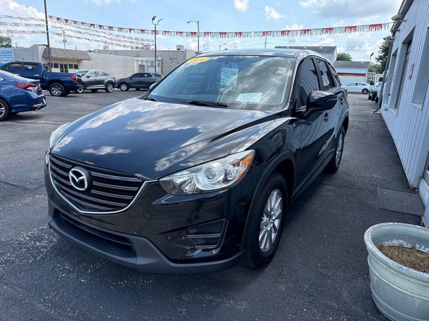 2016 BLACK MAZDA CX-5 SPORT (JM3KE2BY8G0) with an 2.5L engine, Automatic transmission, located at 501 E. Columbia St., Springfield, OH, 45503, (800) 262-7122, 39.925262, -83.801796 - *** 1 Owner *** 29 Records on CarFax *** Back Up Camera *** New Battery *** Inspection *** Oil Change *** Sport *** FWD *** Jay North Auto has offered hand picked vehicles since 1965! Our customer's enjoy a NO pressure buying experience with a small town feel. We are a preferred dealer for many- Photo#2