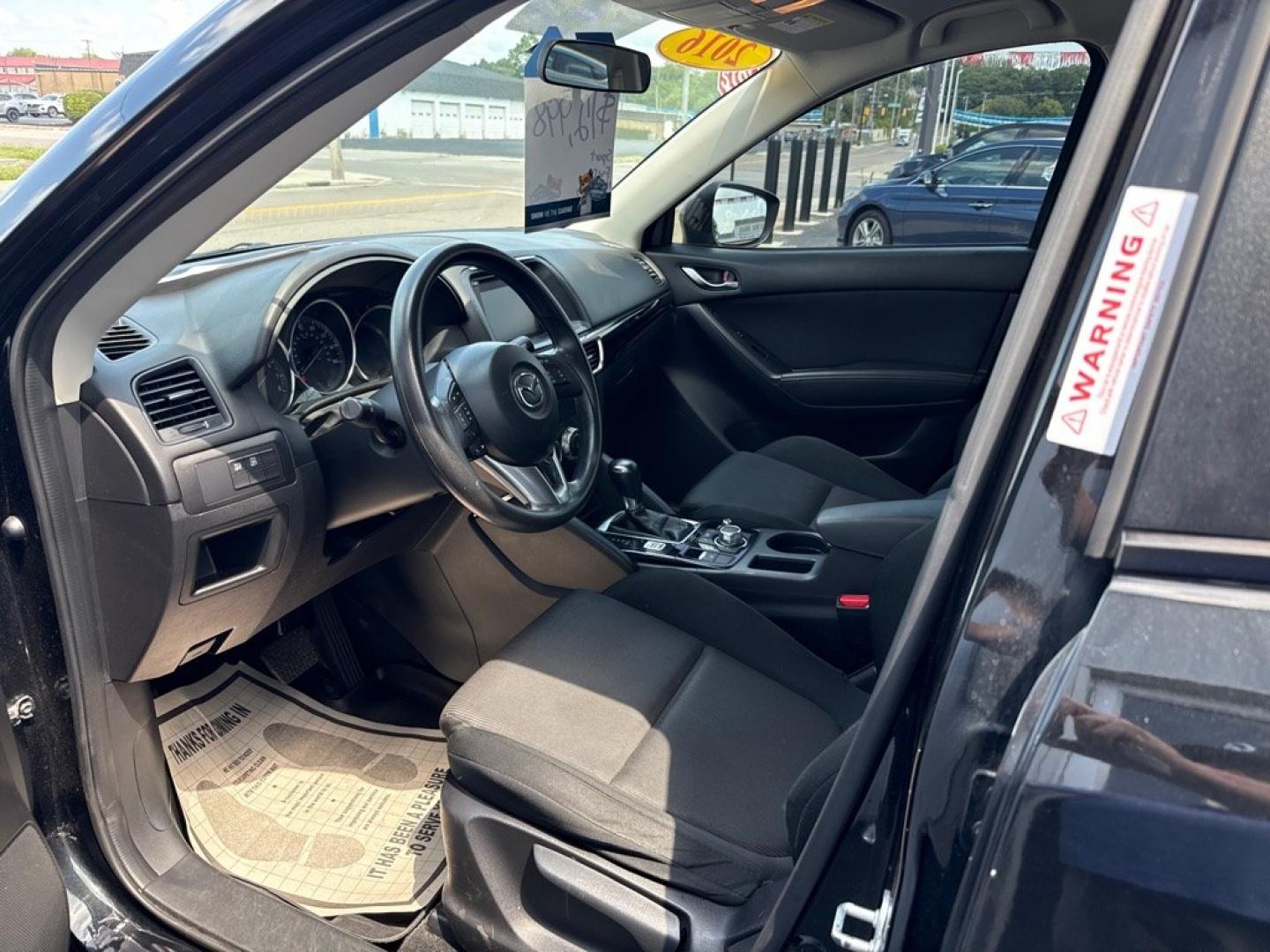 2016 BLACK MAZDA CX-5 SPORT (JM3KE2BY8G0) with an 2.5L engine, Automatic transmission, located at 501 E. Columbia St., Springfield, OH, 45503, (800) 262-7122, 39.925262, -83.801796 - *** 1 Owner *** 29 Records on CarFax *** Back Up Camera *** New Battery *** Inspection *** Oil Change *** Sport *** FWD *** Jay North Auto has offered hand picked vehicles since 1965! Our customer's enjoy a NO pressure buying experience with a small town feel. We are a preferred dealer for many- Photo#11
